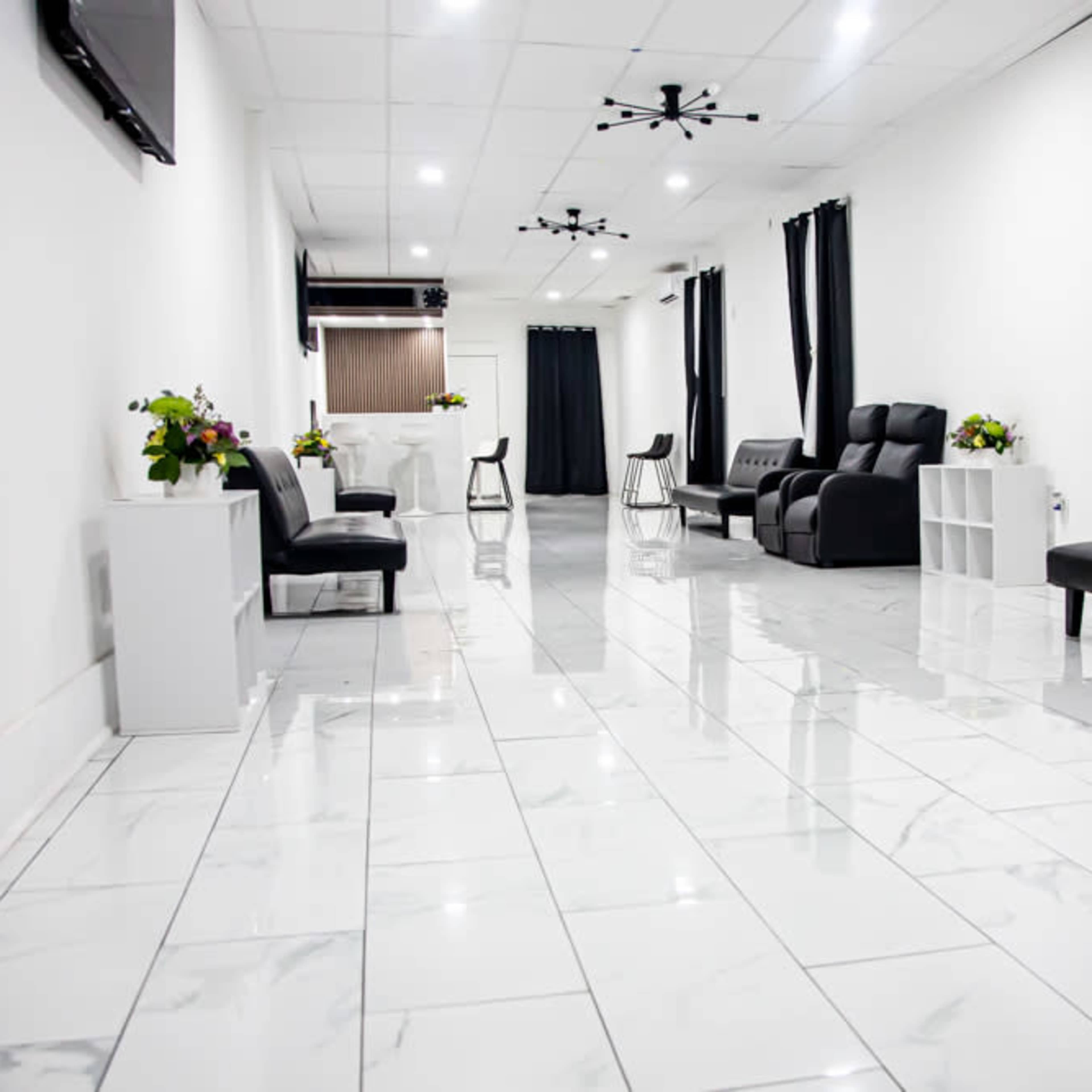 Elegant Black & White Space with Marble Floors and a Wood-Finished Bar Image in Hempstead, Baldwin, NY