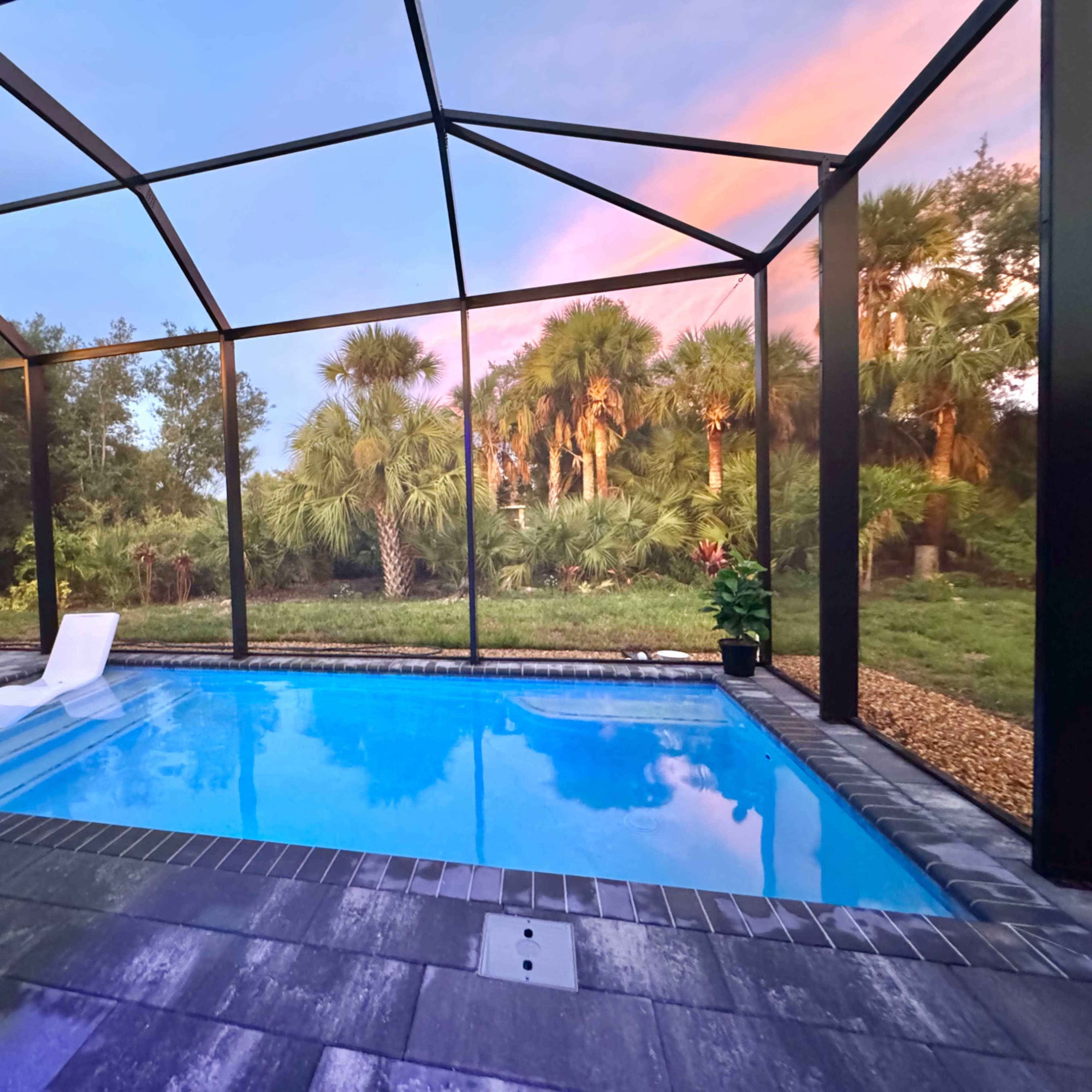 New Home with Large Lanai Well Lit  Pool and Gas Fire Table and Tropical View Image in , Port Charlotte, FL