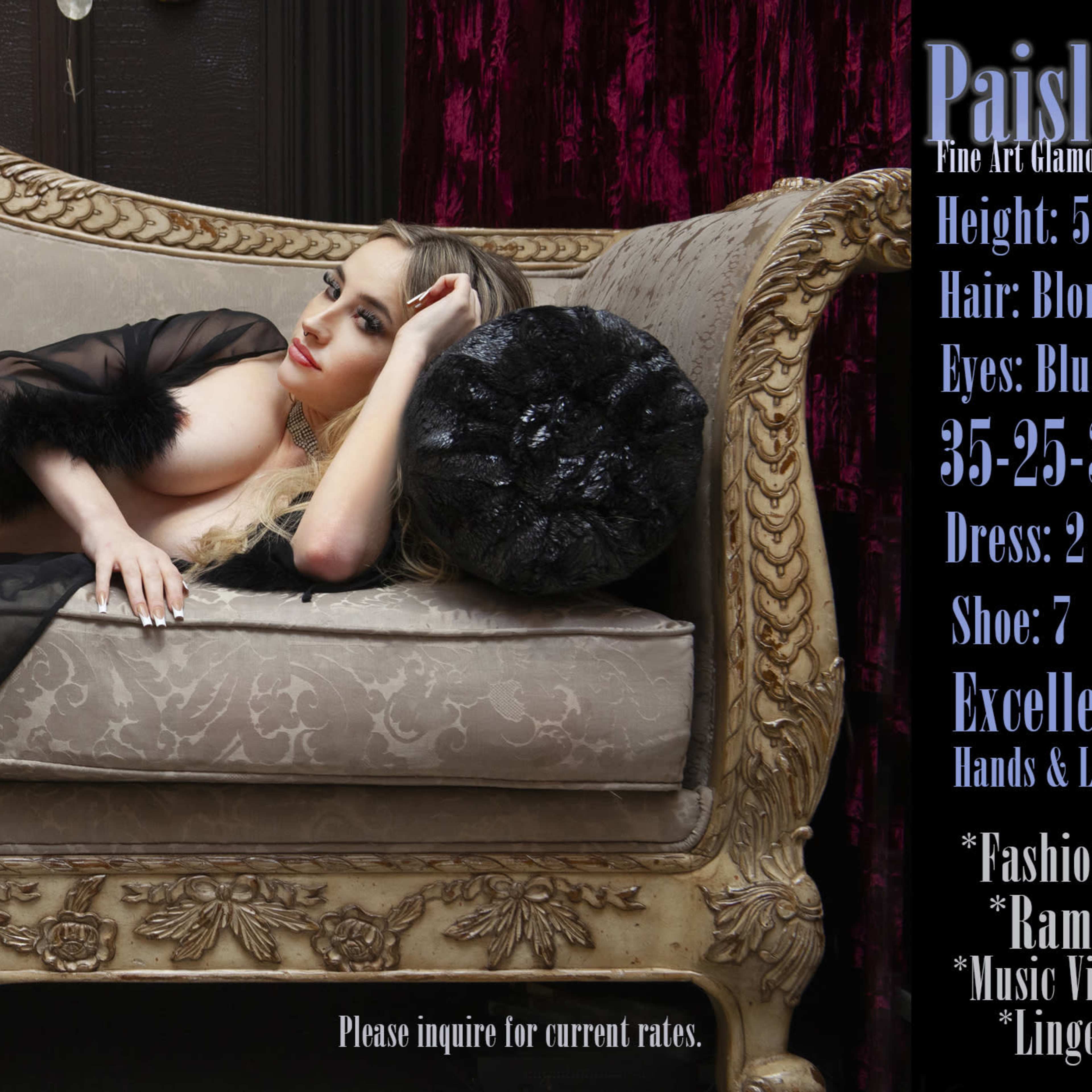 A model posing elegantly on a vintage couch, dressed in sheer fabric, with long blonde hair cascading down.