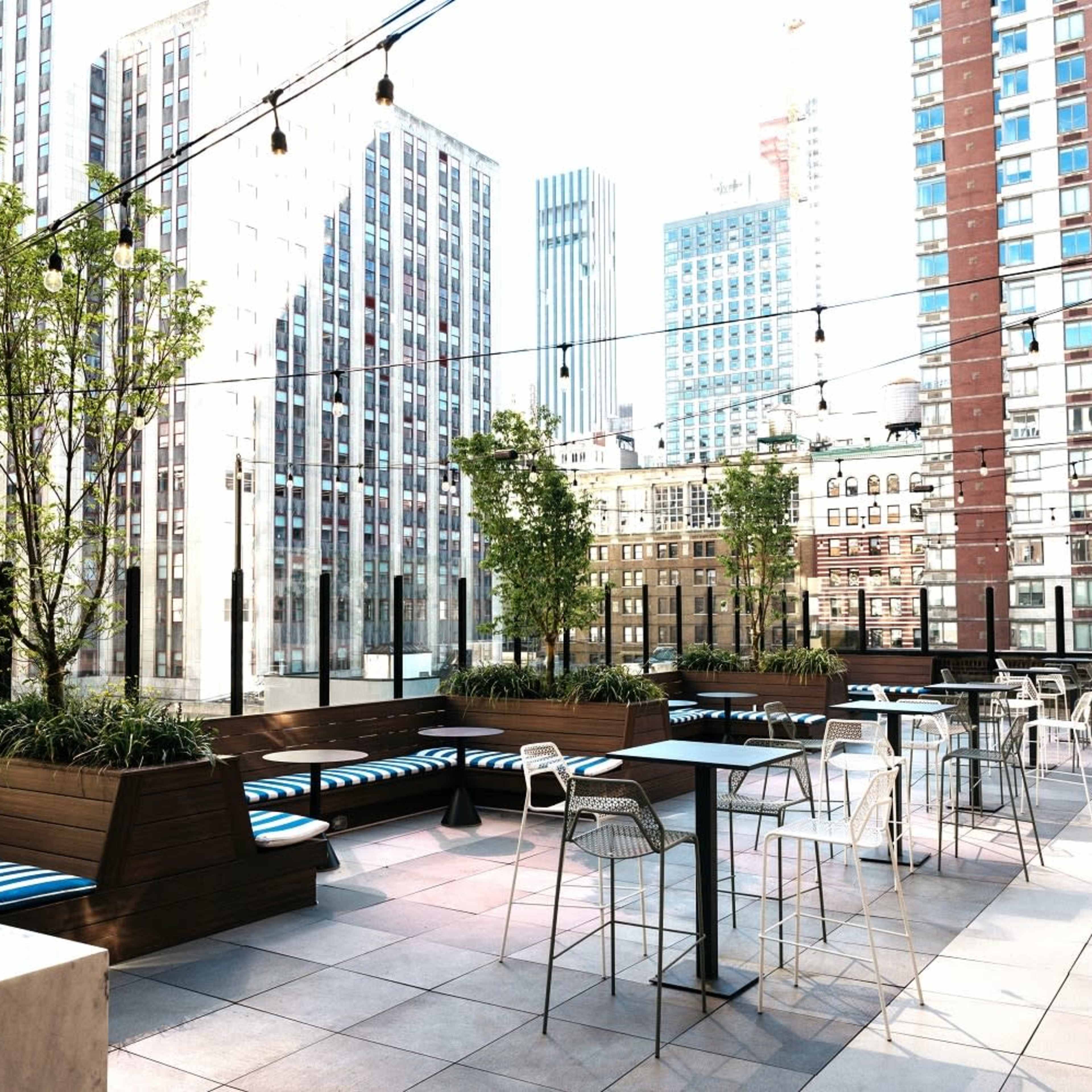 Amazing 2,000 SF Rooftop Terrace in Midtown Overlooking the Empire State Building with Sound System, Seating & Displays - Easy Access from Penn Station - NEW for 2025 Image in Midtown, New York, NY