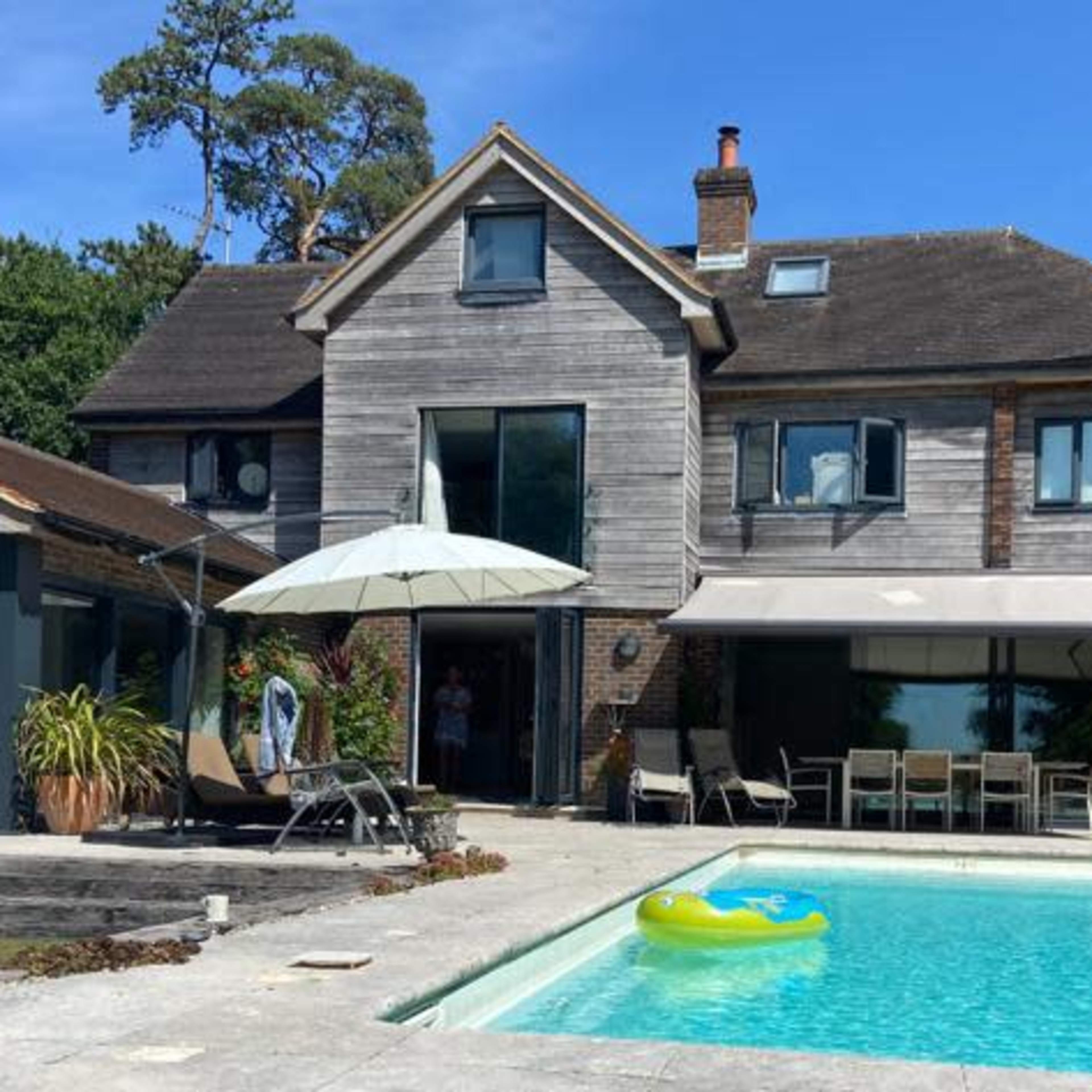 Modern country house with swimming pool and far reaching views Image in Hurstpierpoint and Sayers Common, Hassocks, England