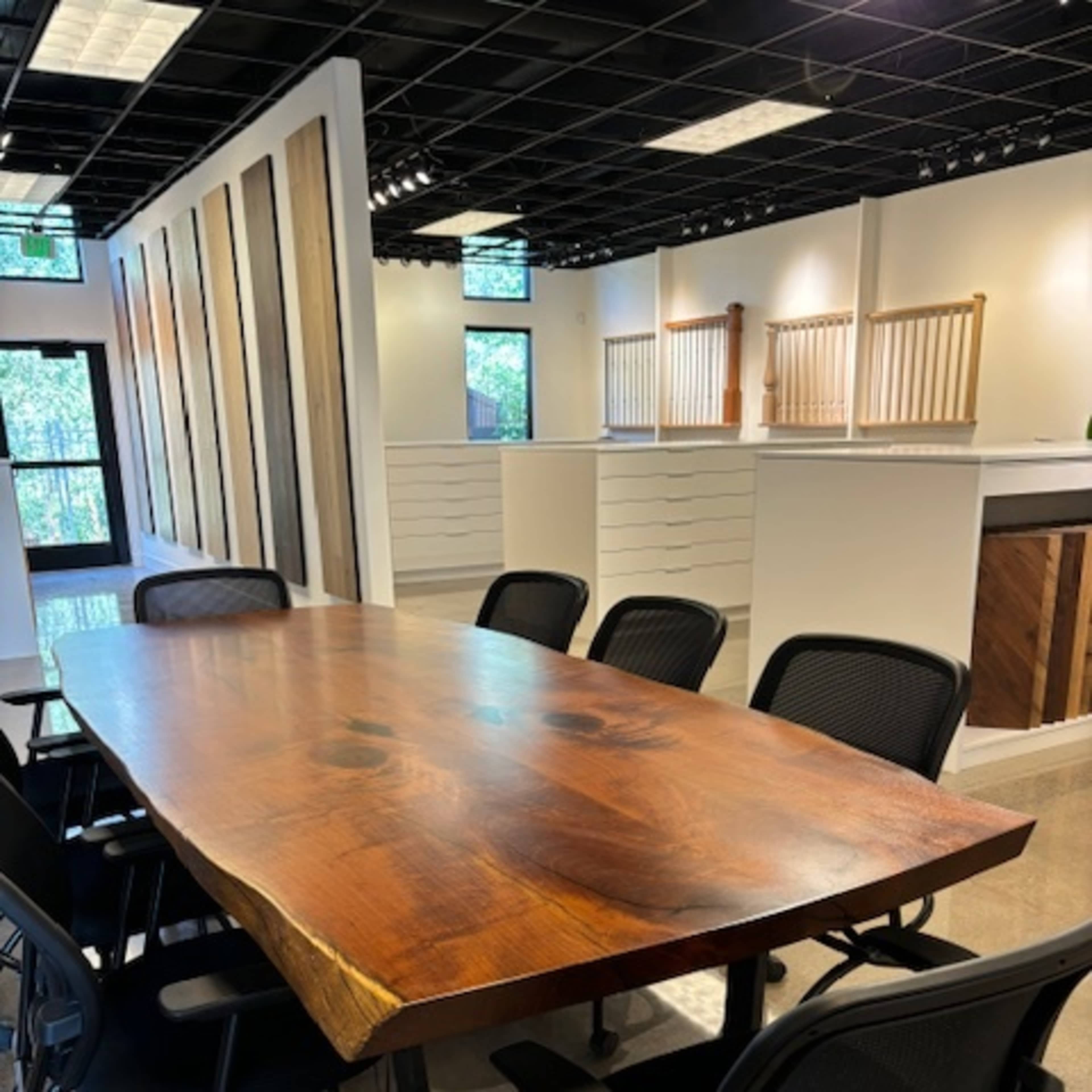 Urban flooring gallery space with a bar, entertainment patio, and golf simulator. Image in Central, Denver, CO
