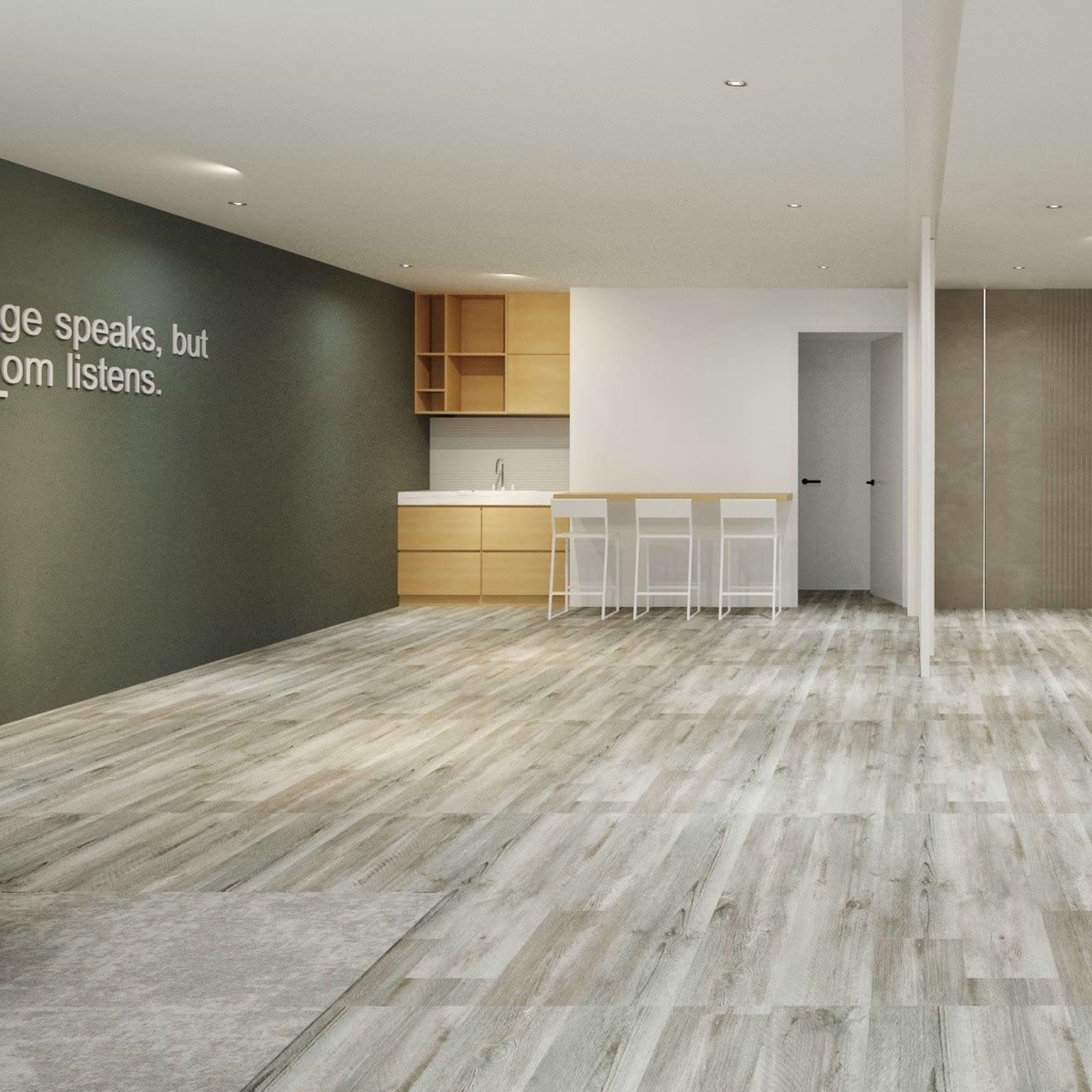 A modern, open-concept living space featuring light wood flooring, a kitchenette with wooden cabinets, and a minimalist decor on the walls.