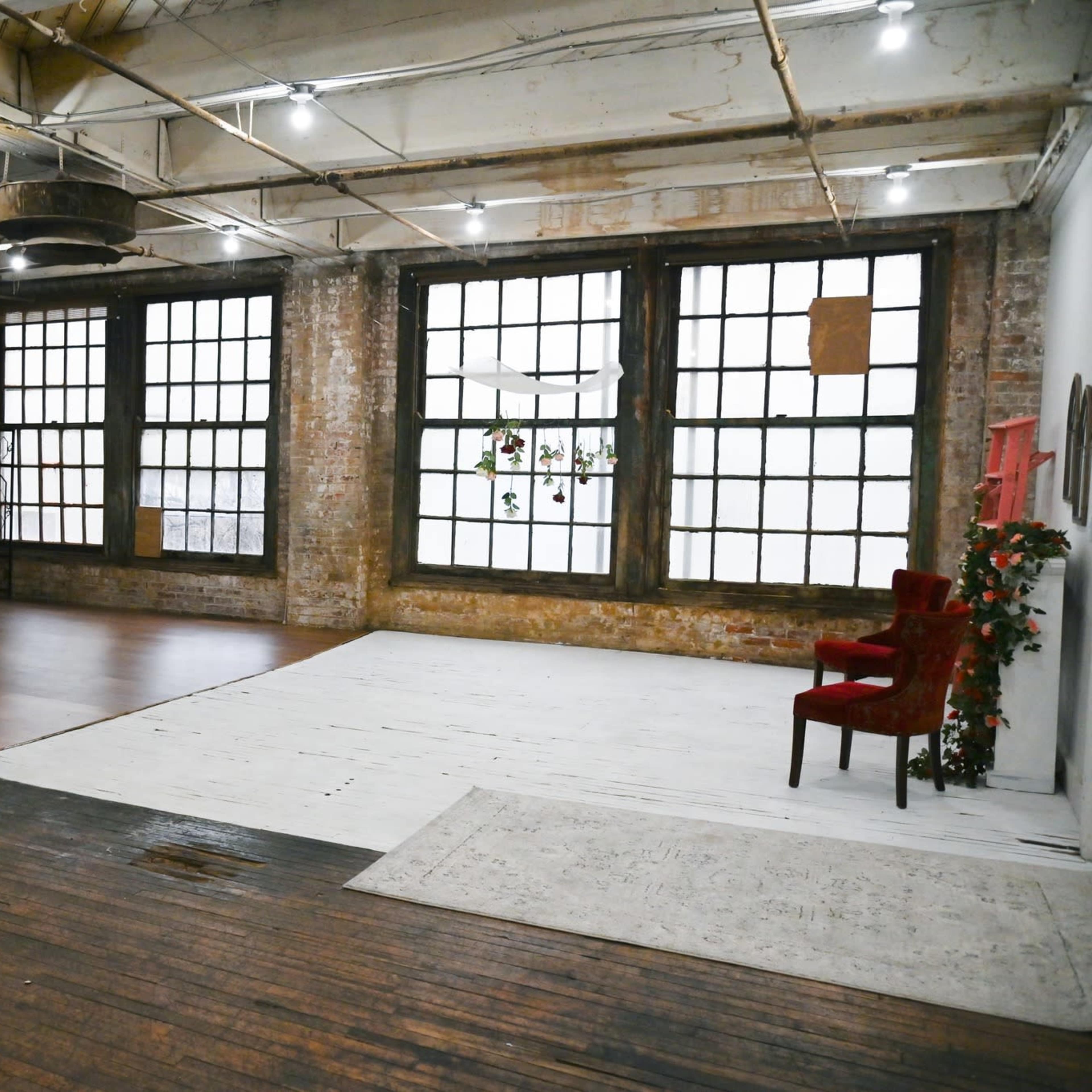 Urban Downtown Studio with big windows, natural light, AC, photography props, and professional lighting equipment. Image in Burkhardt, Dayton, OH