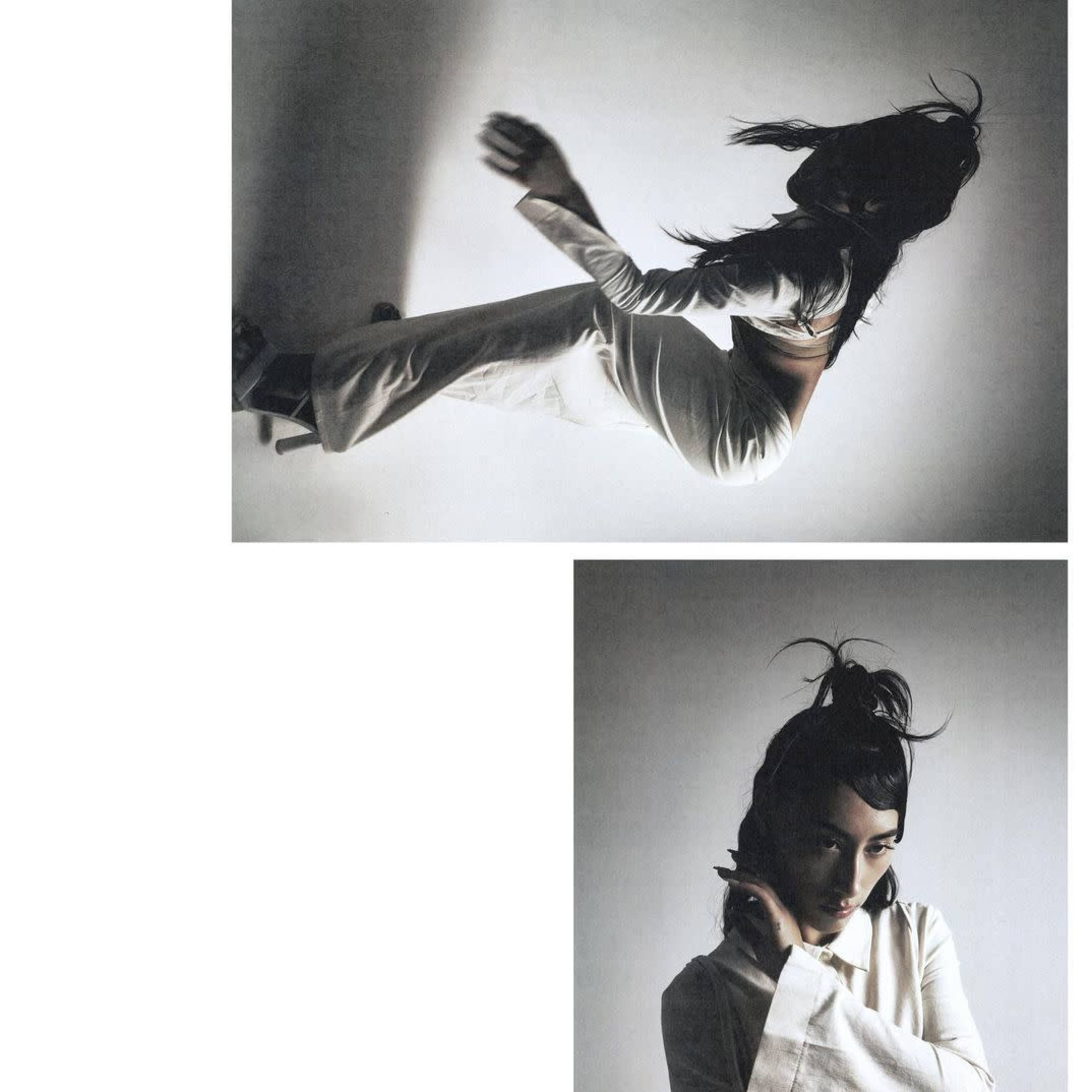 A figure in a white outfit poses dynamically against a grey background, capturing movement and style.
