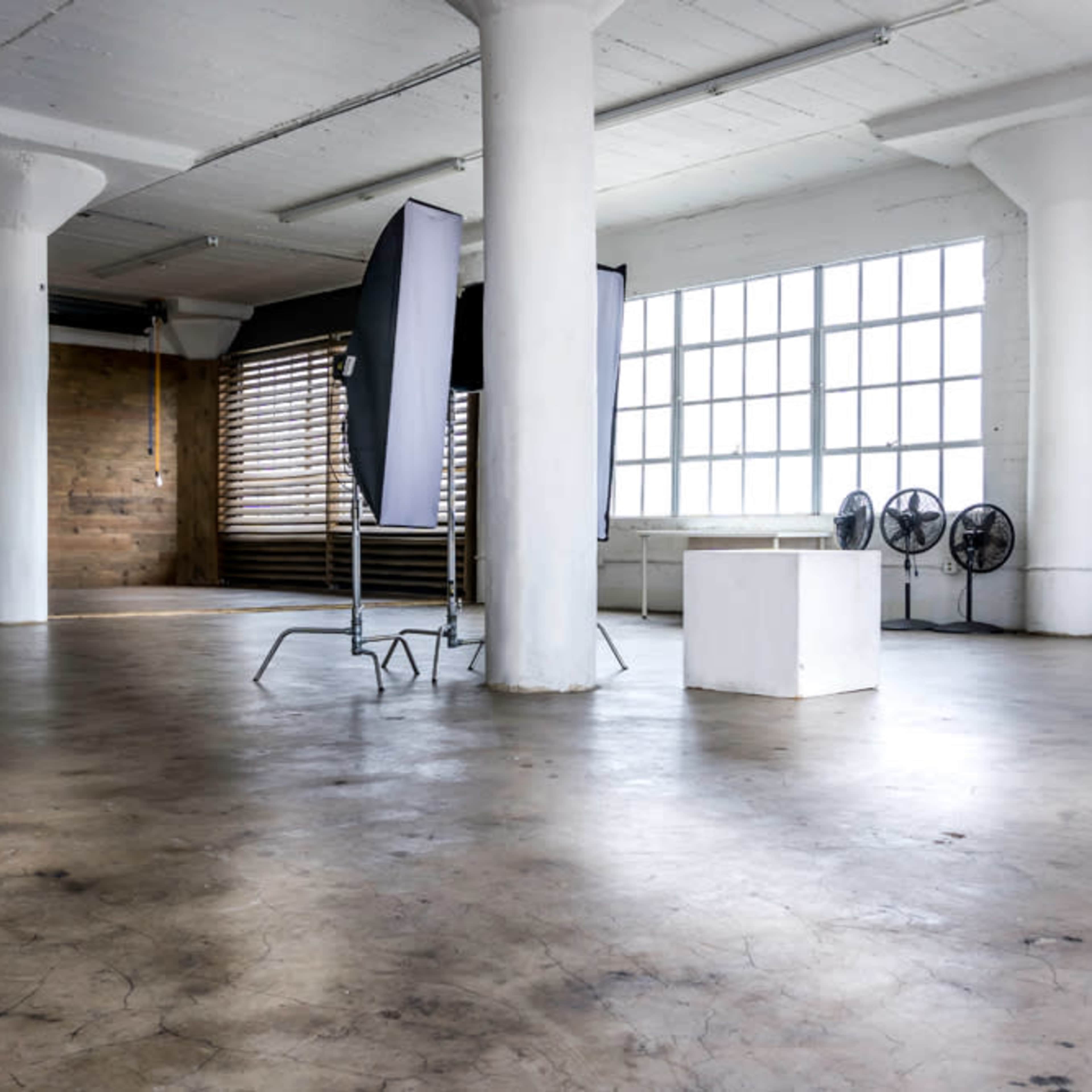 Daylight photo studio with Dark Wood Corner, large marquee star, wooden blinds, Red Furniture Set and Egg-Shaped Hanging Chair - Santee 4 Image in Central LA, Los Angeles, CA