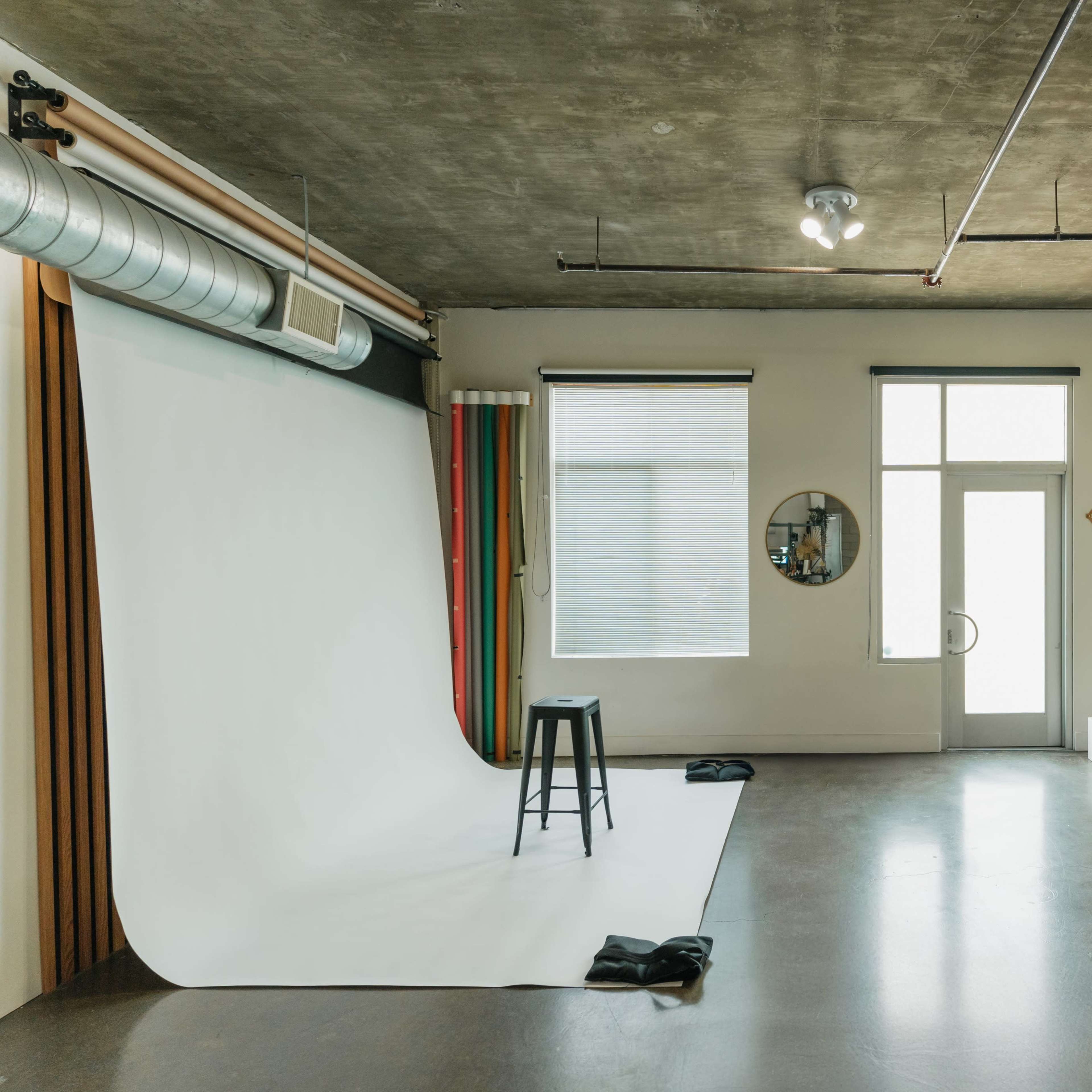 Urban Photo Loft with Natural light, Arched Plaster Wall, Paper Backdrops, Wood Slat Wall and Available Peacock Chair Image in Downtown Anaheim, Anaheim, CA
