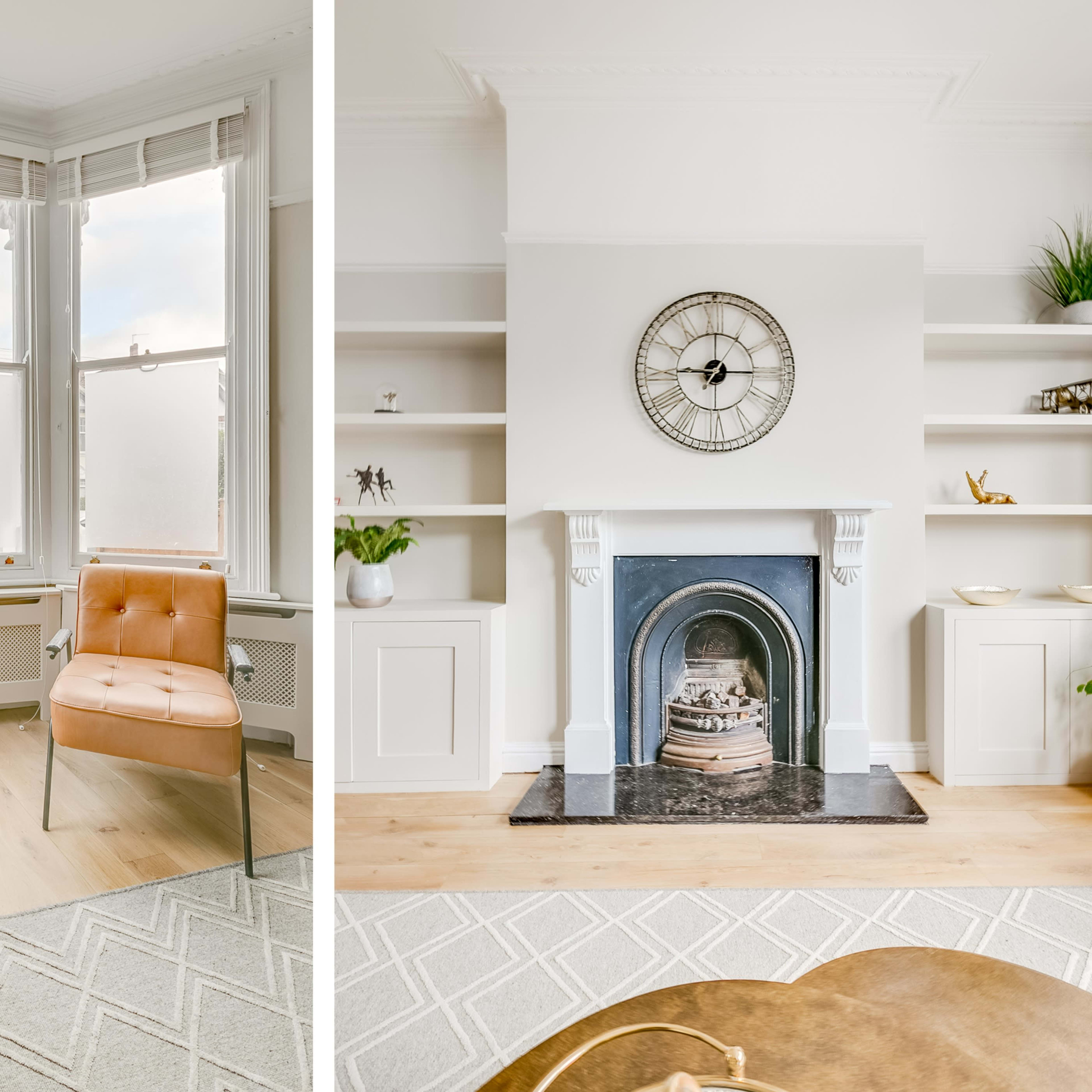 A bright living room featuring two orange chairs and a fireplace flanked by built-in shelves.