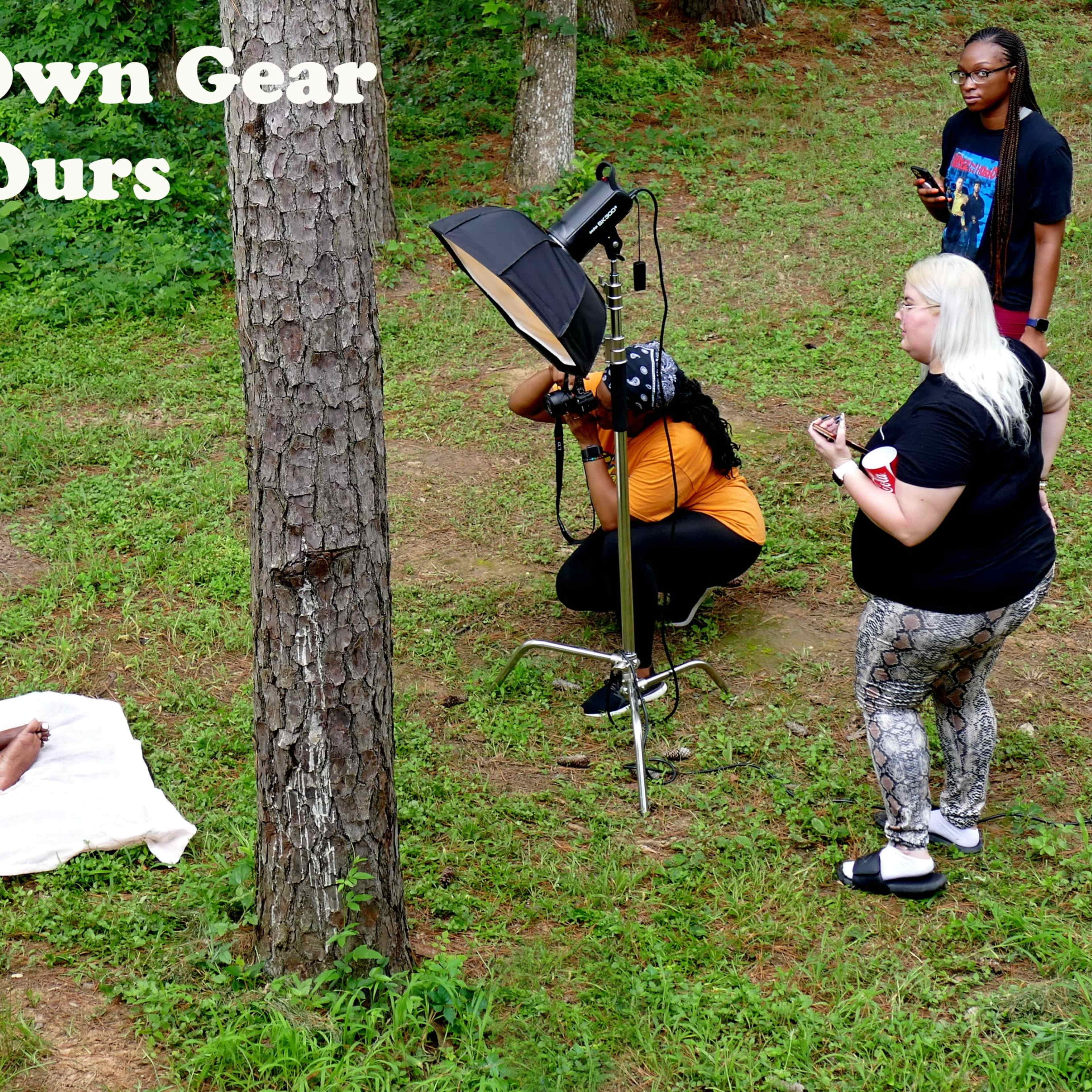 A photoshoot takes place outdoors, featuring a model seated on the ground with a bouquet, while photographers and assistants adjust equipment nearby.