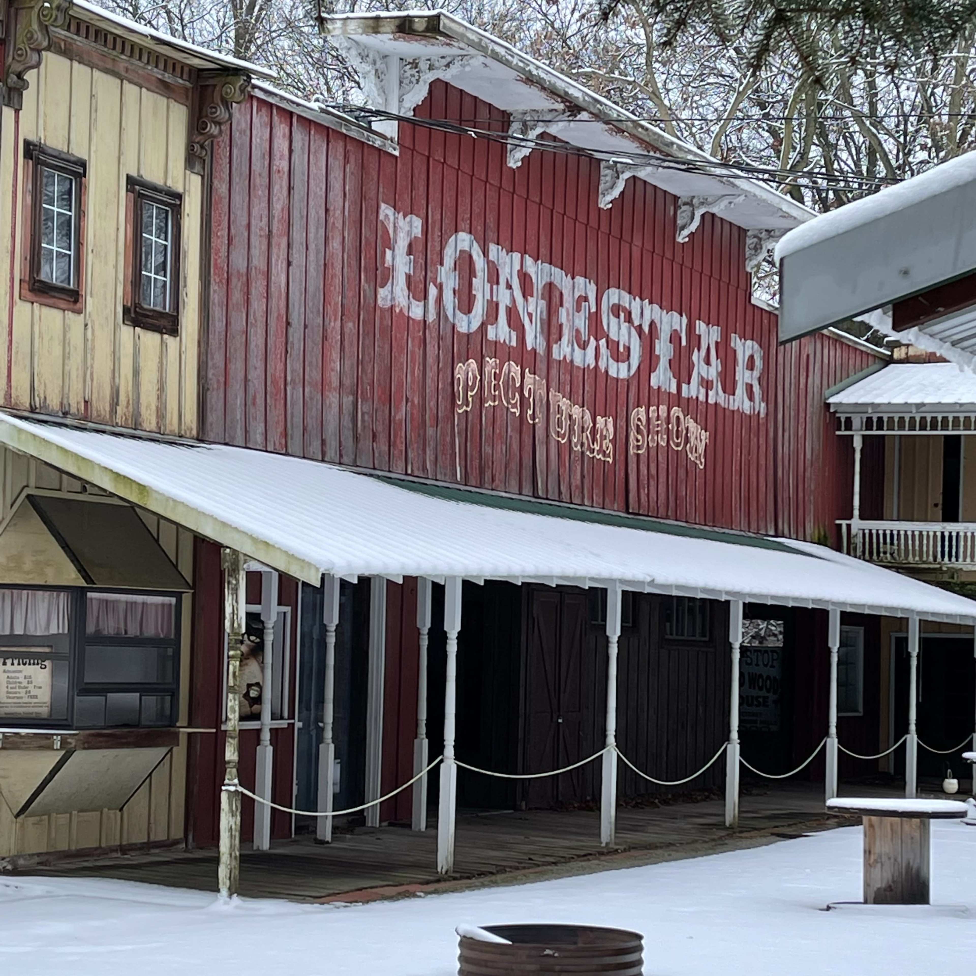 A western-style storefront with a sign that reads "Lone Star" in a snowy setting.