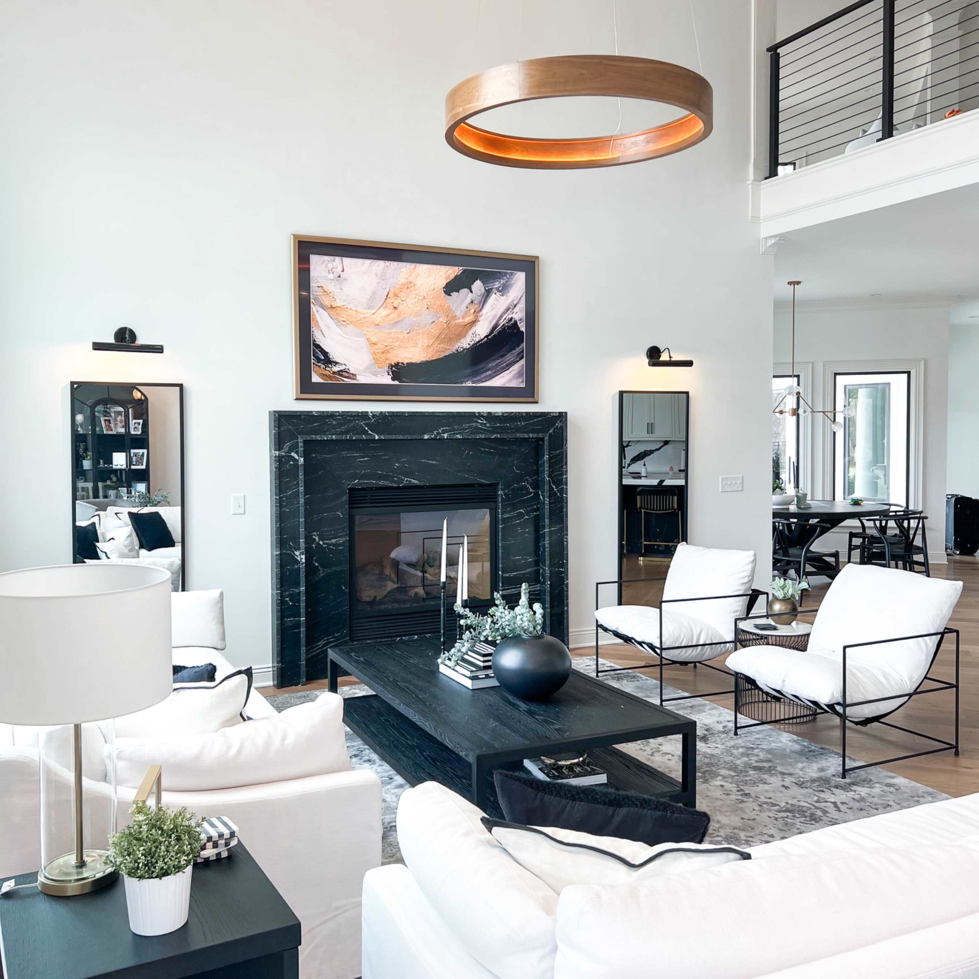 Picturesque tree lined home on a pond with a swimming pool, open concept floor plan, and modern decor. Image in Jefferson Township, Galloway, OH