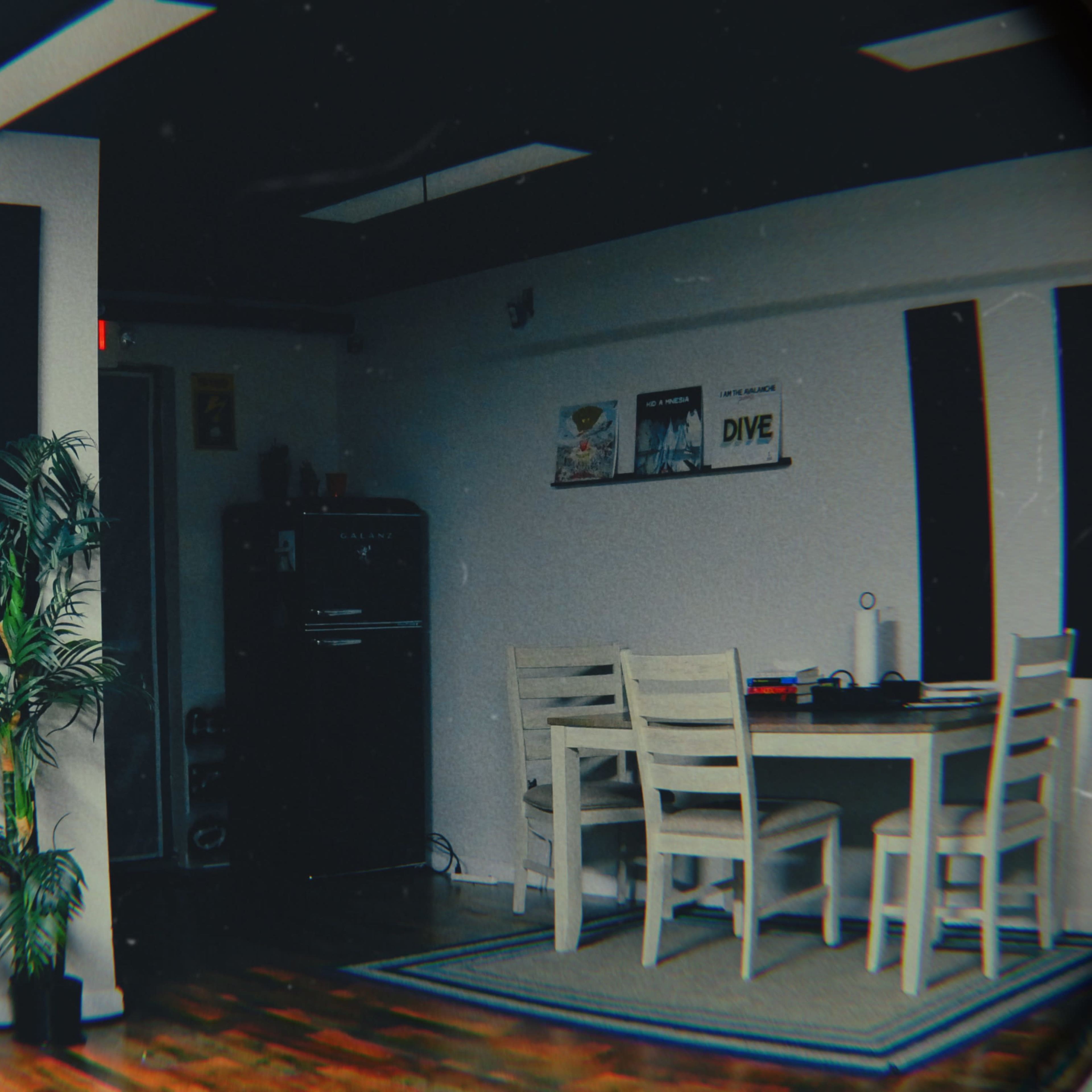 A room featuring a white piano, a dining table with chairs, and various decorations on the walls.