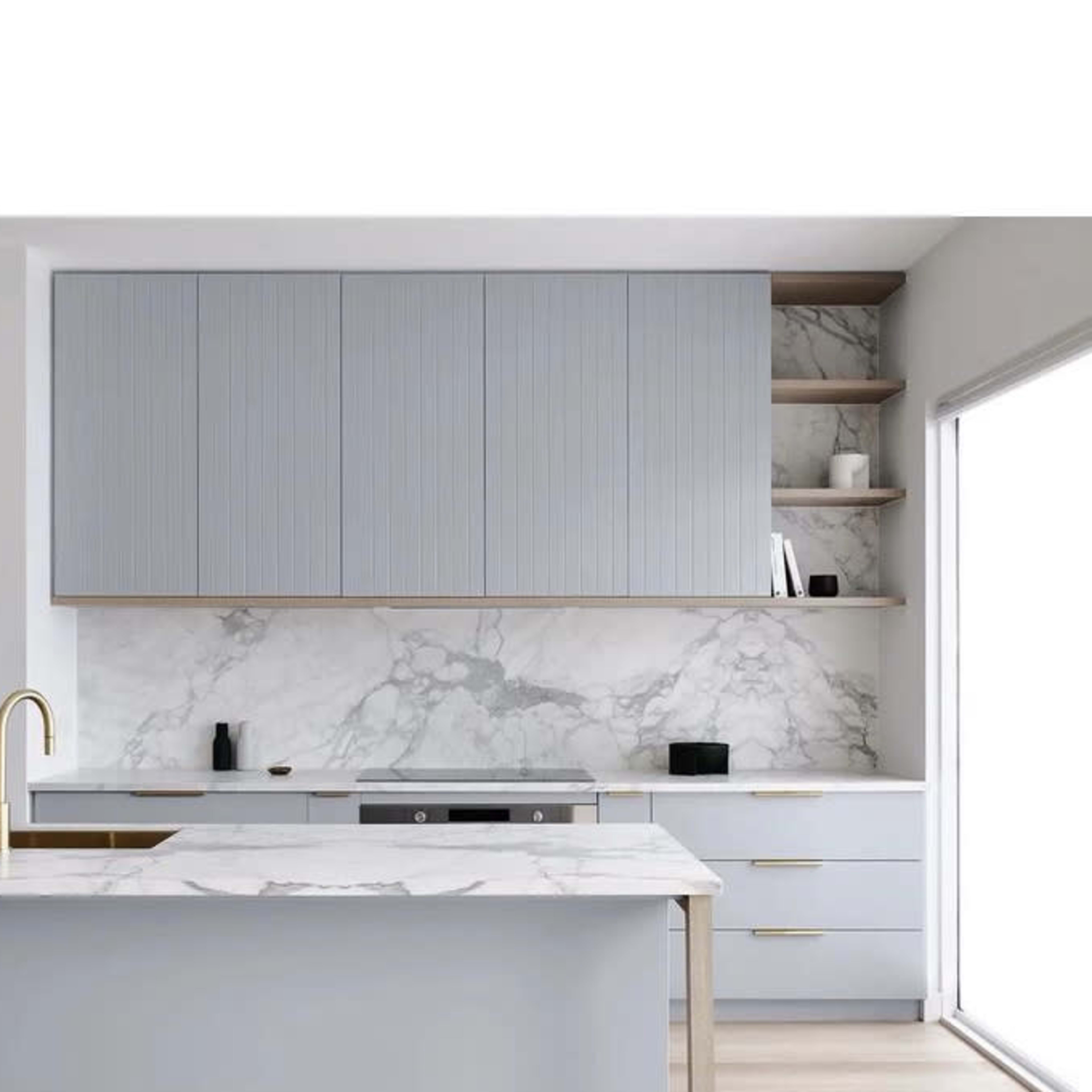 A modern kitchen with light blue cabinetry, marble countertops, and a marble backsplash.