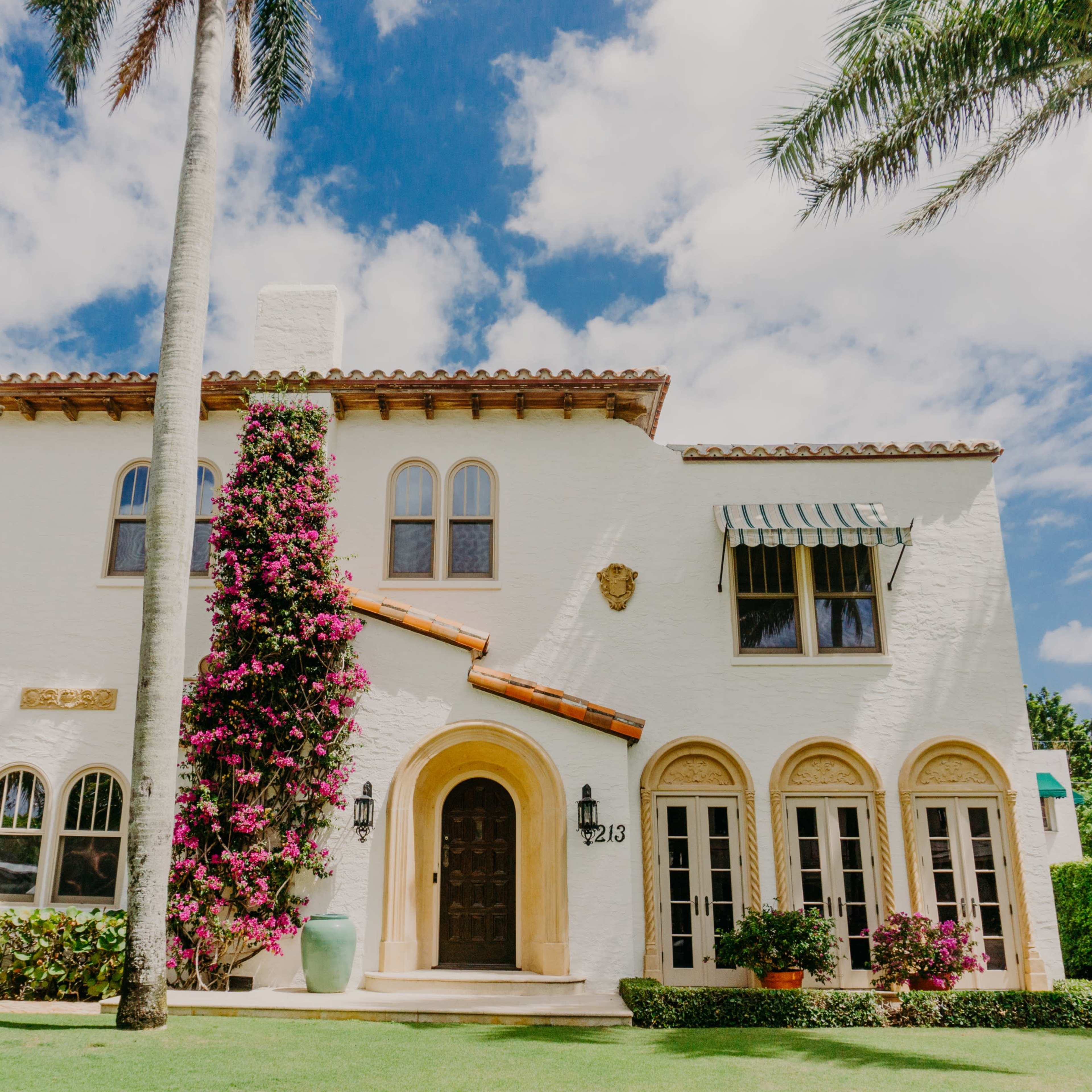 Nestled in the heart of West Palm Beach, this enchanting 1920s Mediterranean Spanish-style home exudes timeless elegance and Old World charm. The property is a true reflection of Palm Beach’s storied past, featuring exquisite Moorish and Spanish architectural details throughout, from arched doorways to intricately tiled floors and ornate ironwork. The spacious interior boasts a harmonious blend of classic design and contemporary luxury, offering the perfect backdrop for captivating photo shoots. Step outside to discover a lushly landscaped oasis, where a serene pool and a charming tennis court invite relaxation and recreation. The expansive grounds are complemented by a stunning guest house, ideal for hosting visiting talent or creative teams. With its beautiful mix of vintage character and refined spaces, this home offers an unparalleled atmosphere of sophistication and charm. Whether capturing the allure of the grand interiors or the tranquility of the outdoor retreat, this property provides a versatile and captivating setting. Experience the beauty and elegance of Old Palm Beach in a space that effortlessly inspires creativity and timeless visual storytelling. Image in Southside, West Palm Beach, FL
