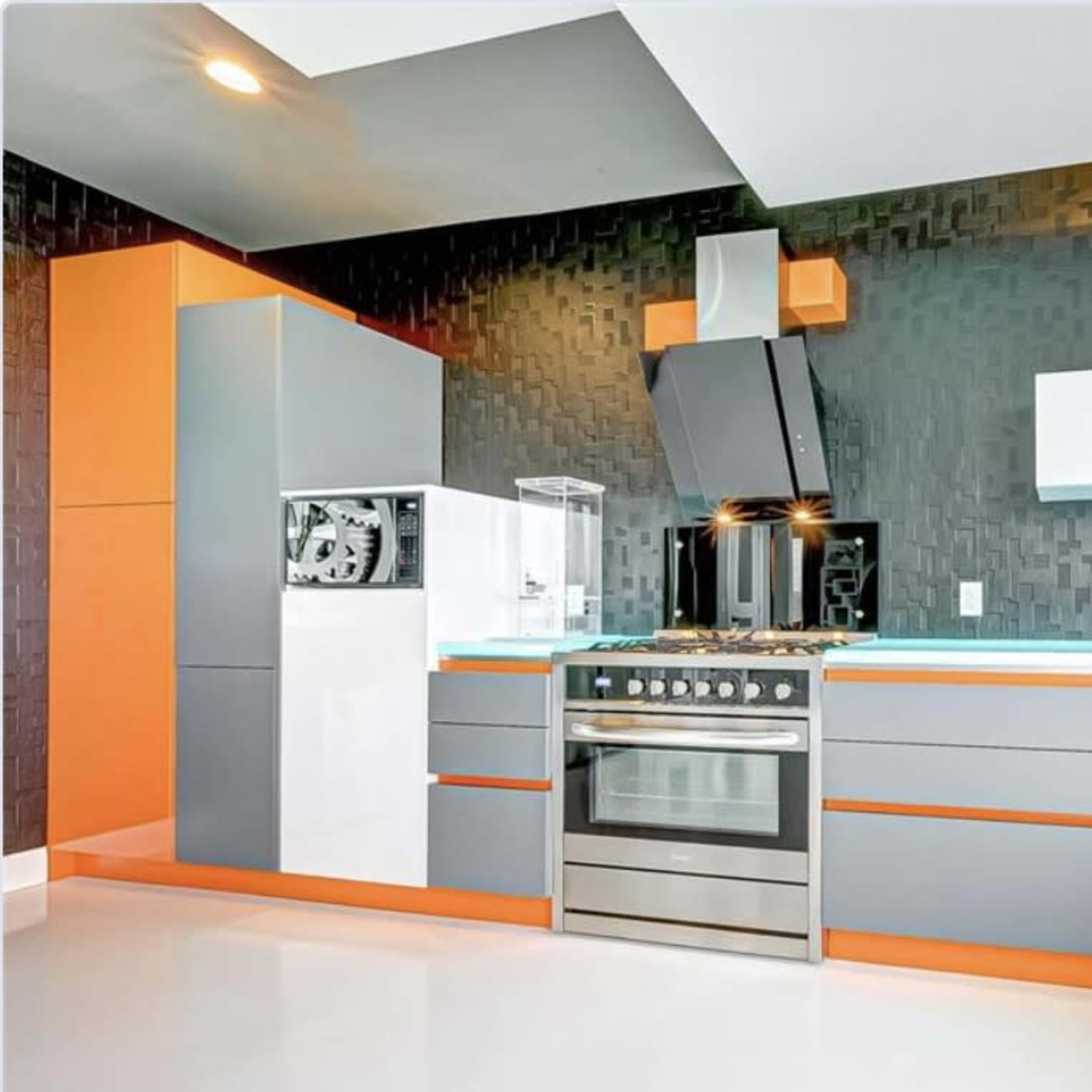 A modern kitchen features gray cabinets with orange accents, a built-in refrigerator, and a stainless steel stove with a hood.