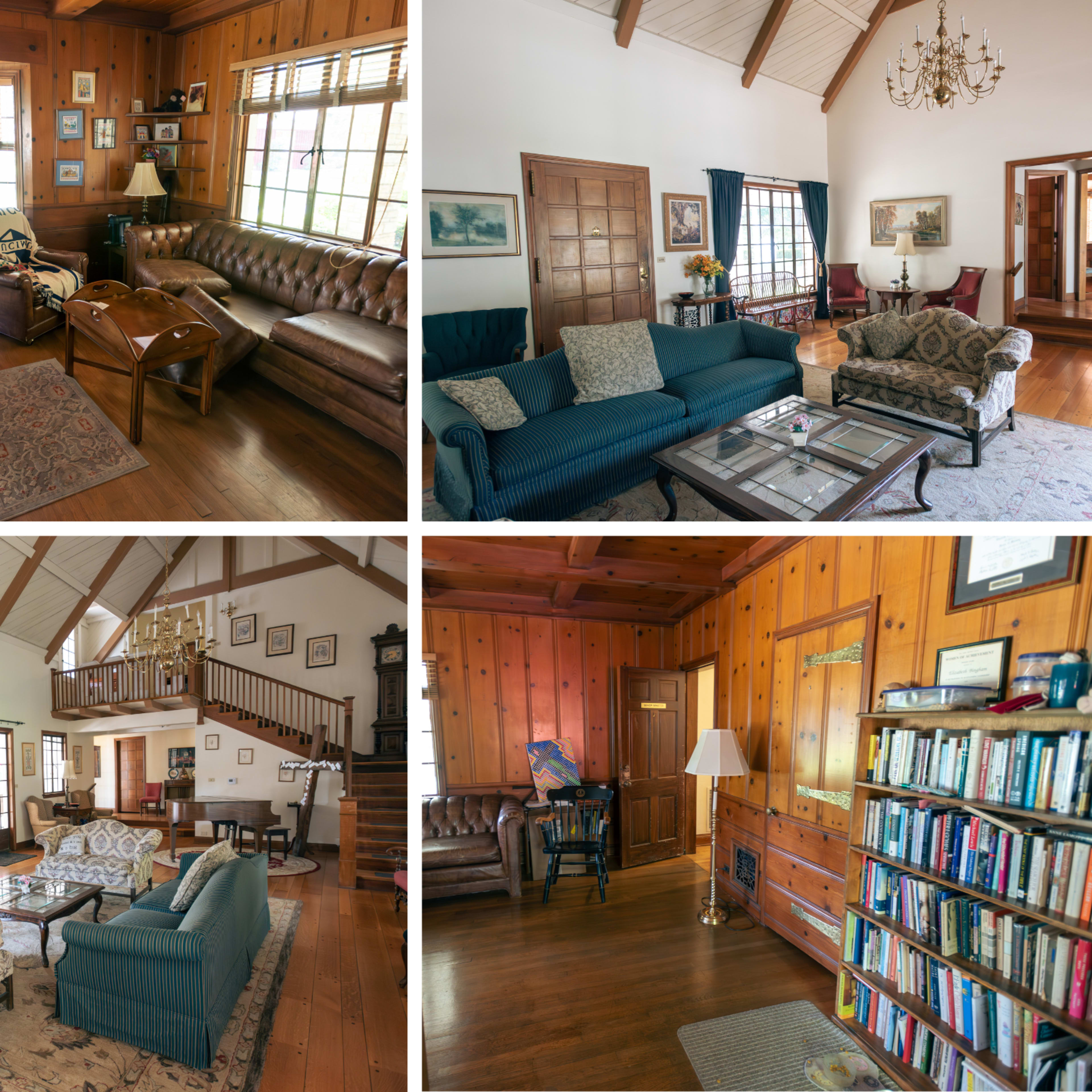 A spacious, wooden-paneled living room with various seating arrangements, decorative items, and a central fireplace.