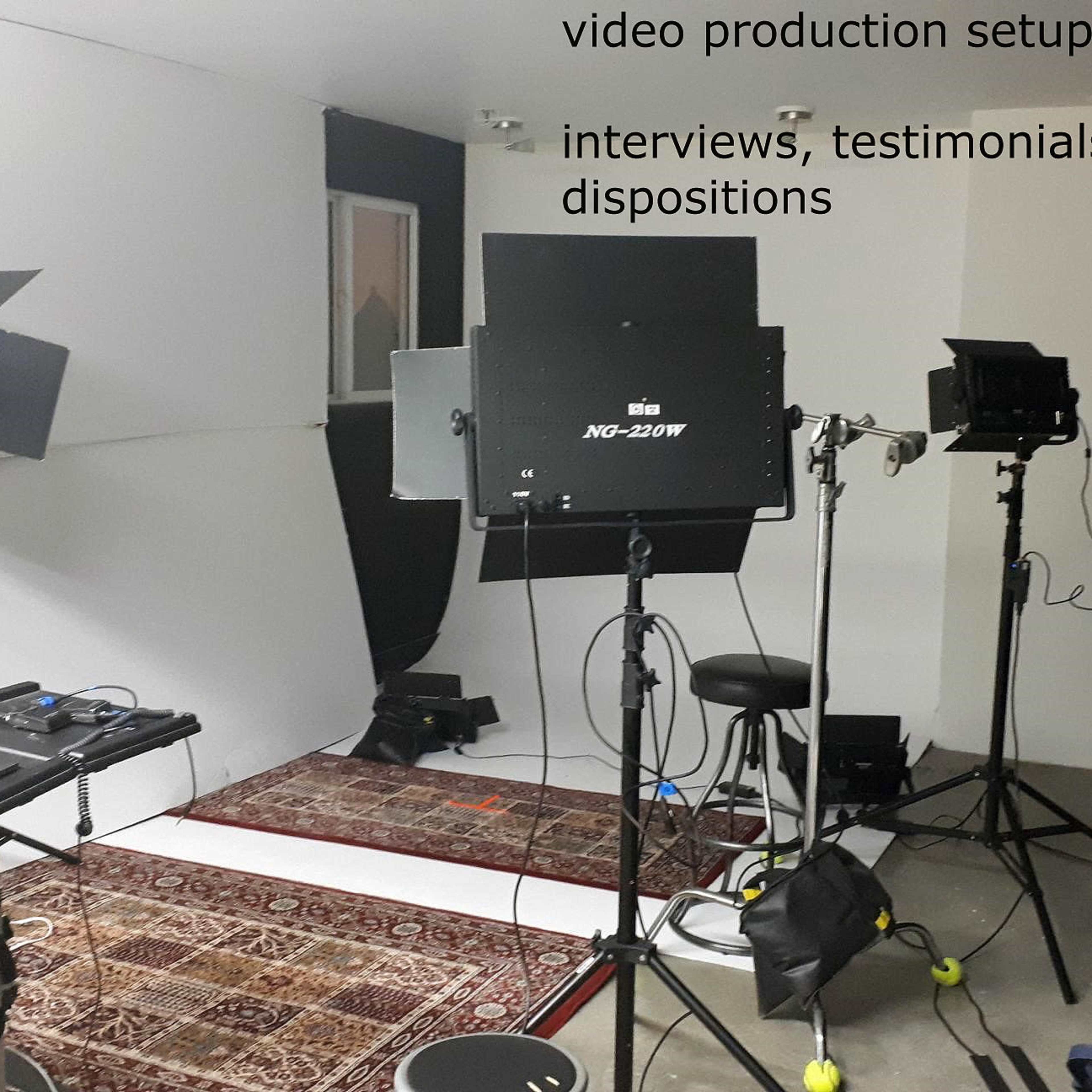 A video production setup with various lights, cameras, and a backdrop, arranged for interviews and testimonials.