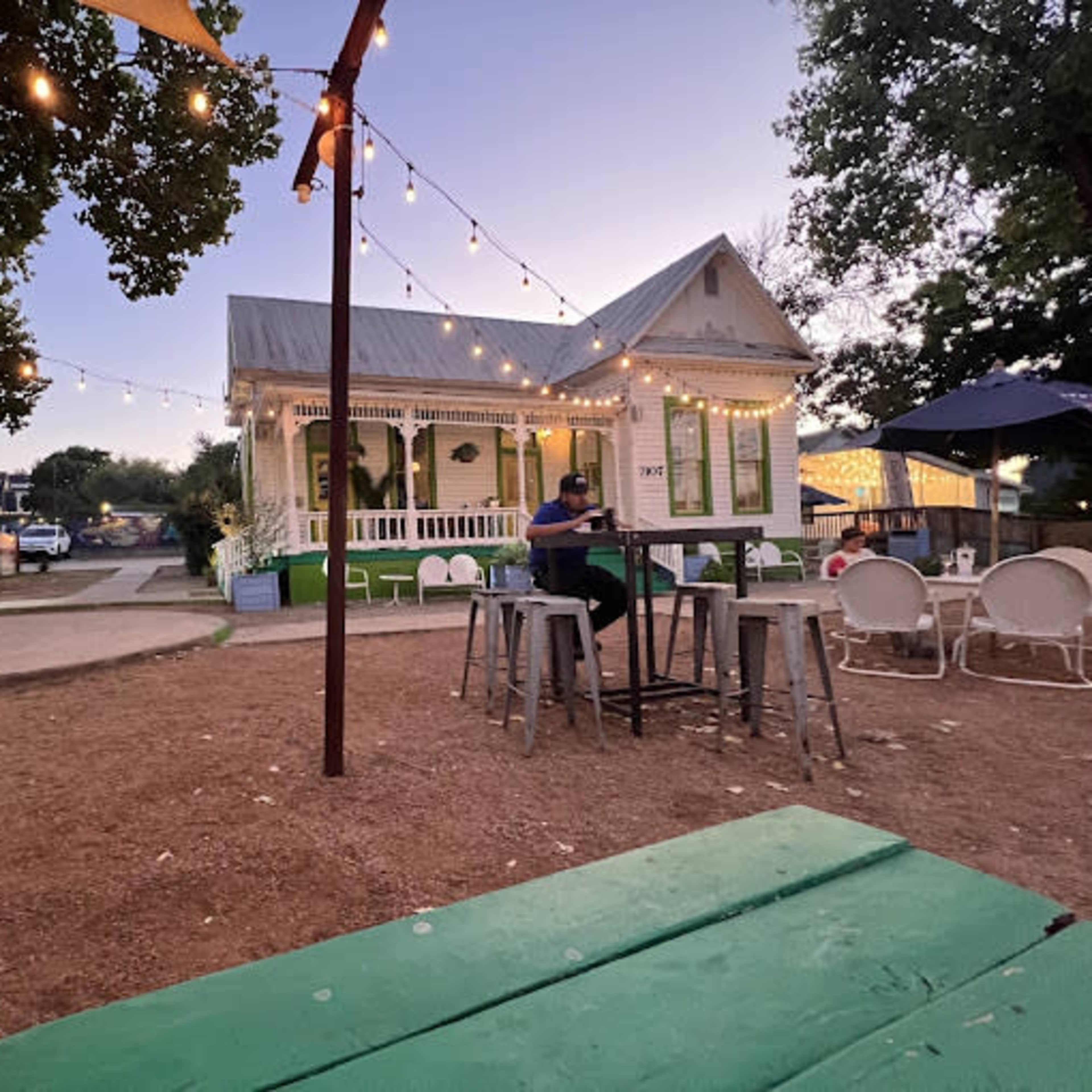 Cute historical house with a huge patio and lovely vibes. Image in Montopolis, Austin, TX