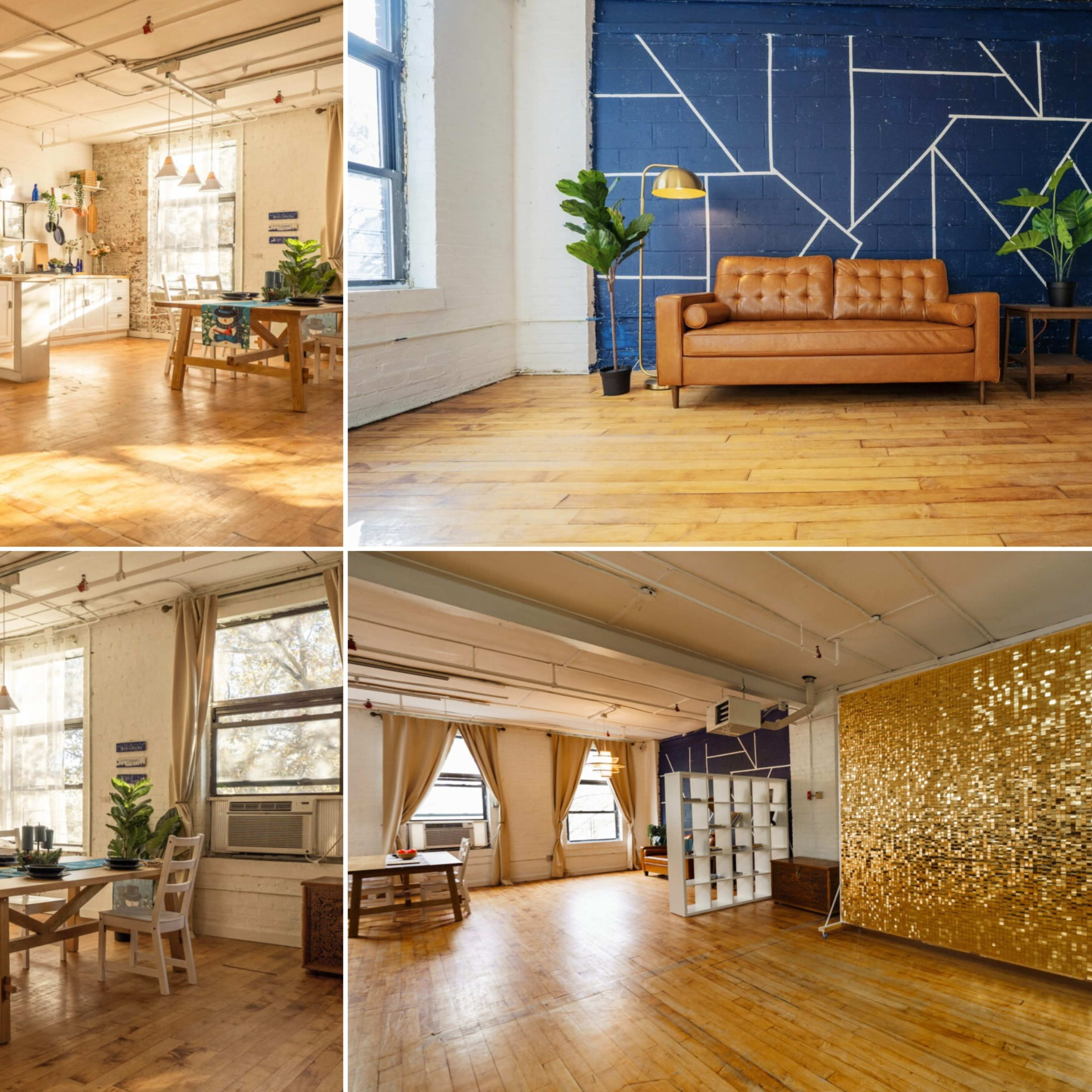 A modern, open-concept workspace featuring a kitchen area, a cozy seating area, and a decorative wall with geometric patterns.