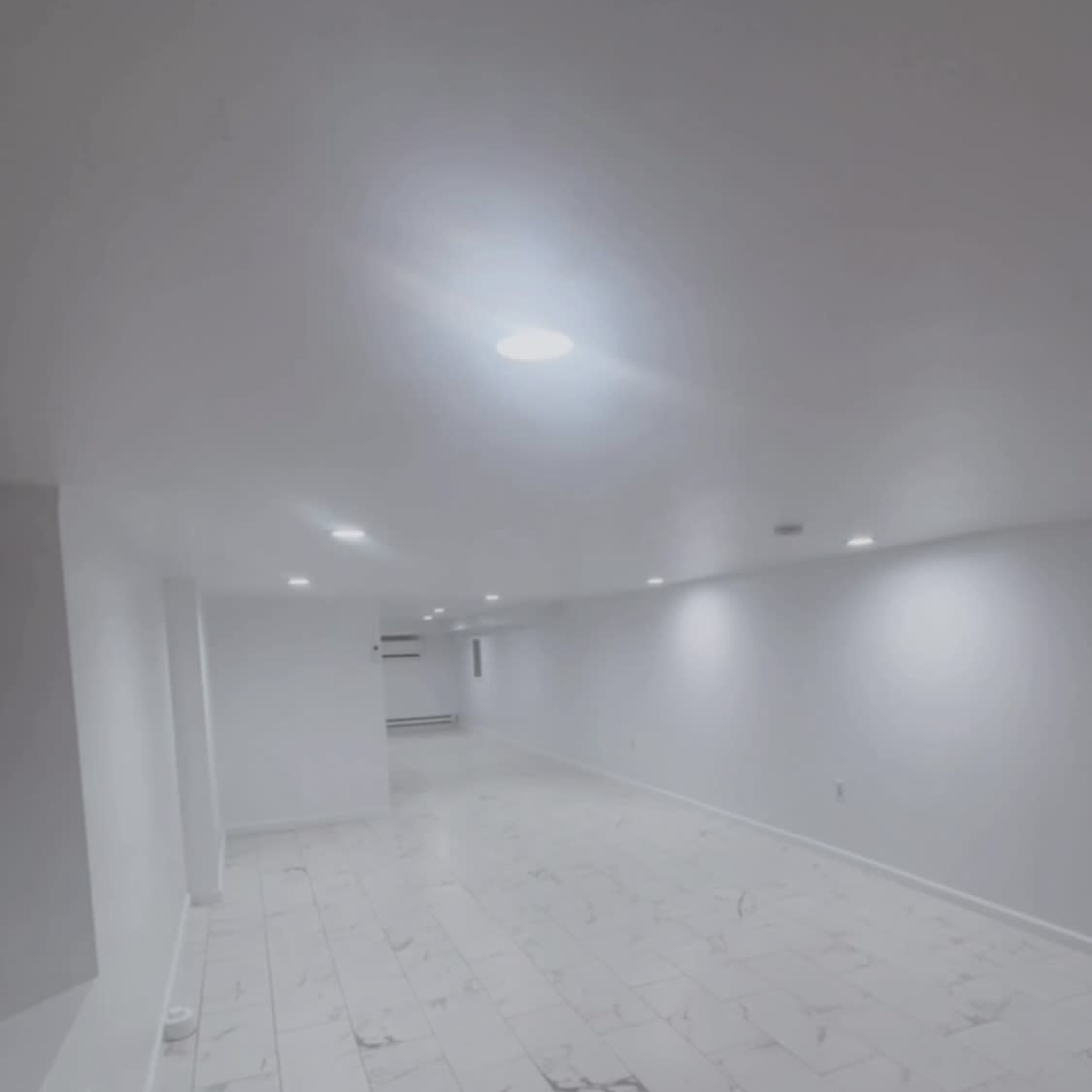 A modern elegant Event Space with white walls, gleaming white marble floors, and stunning customizable lighting, perfect for any occasion. Image in Kingsessing, Philadelphia, PA