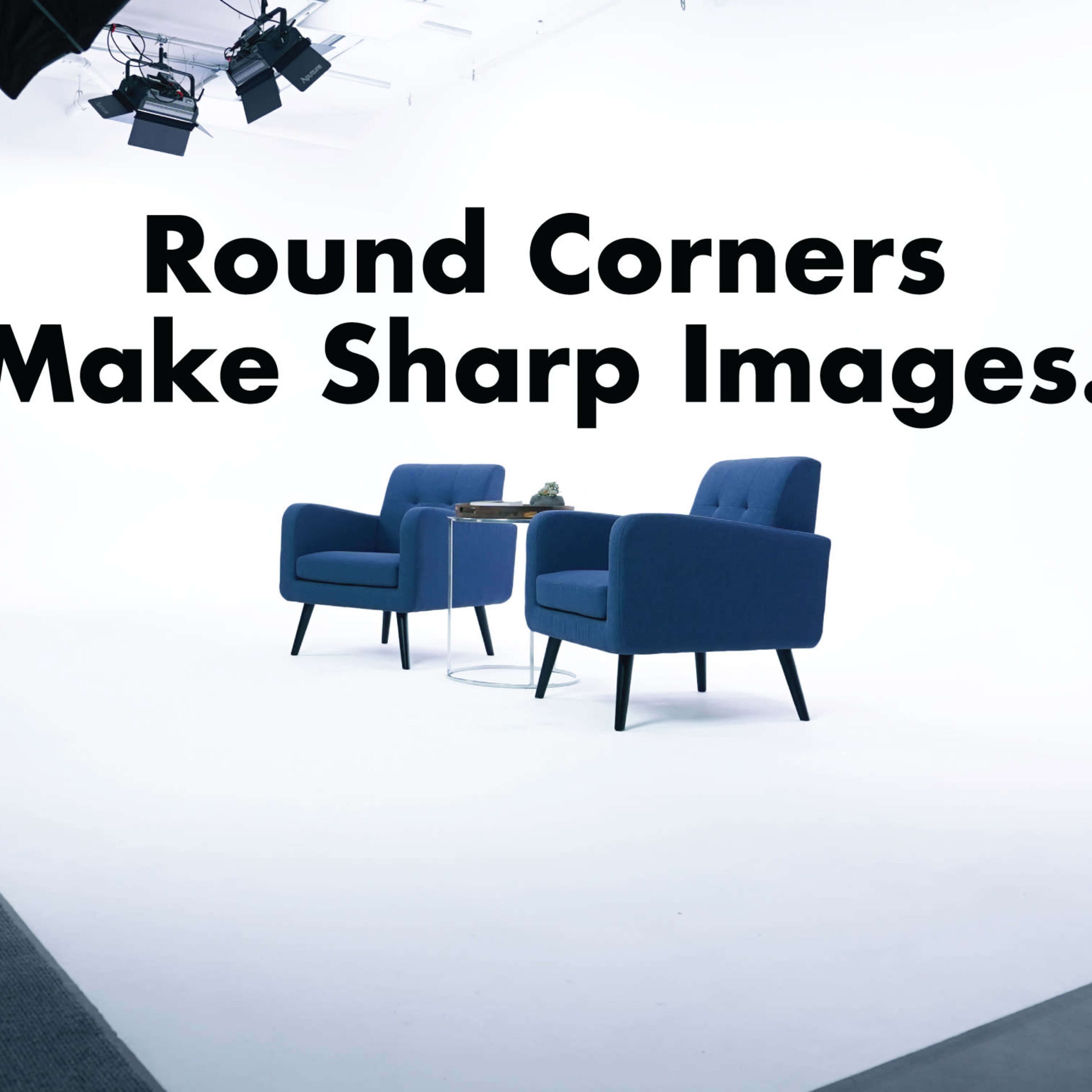 Two blue chairs placed on a white background with studio lighting.