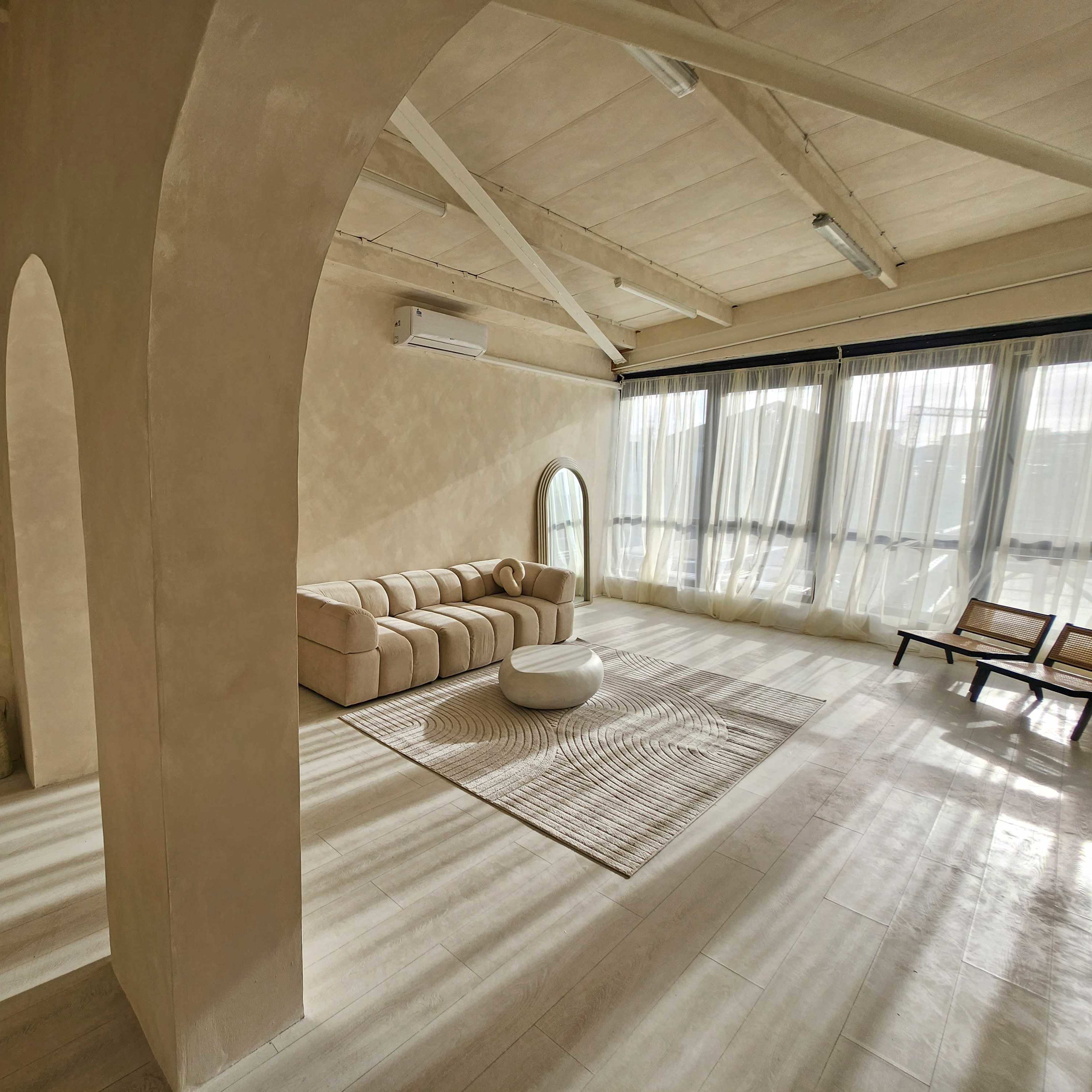 Sun-Kissed Lifestyle Studio with Elegant Arches & Textured Walls Image in London, London, England