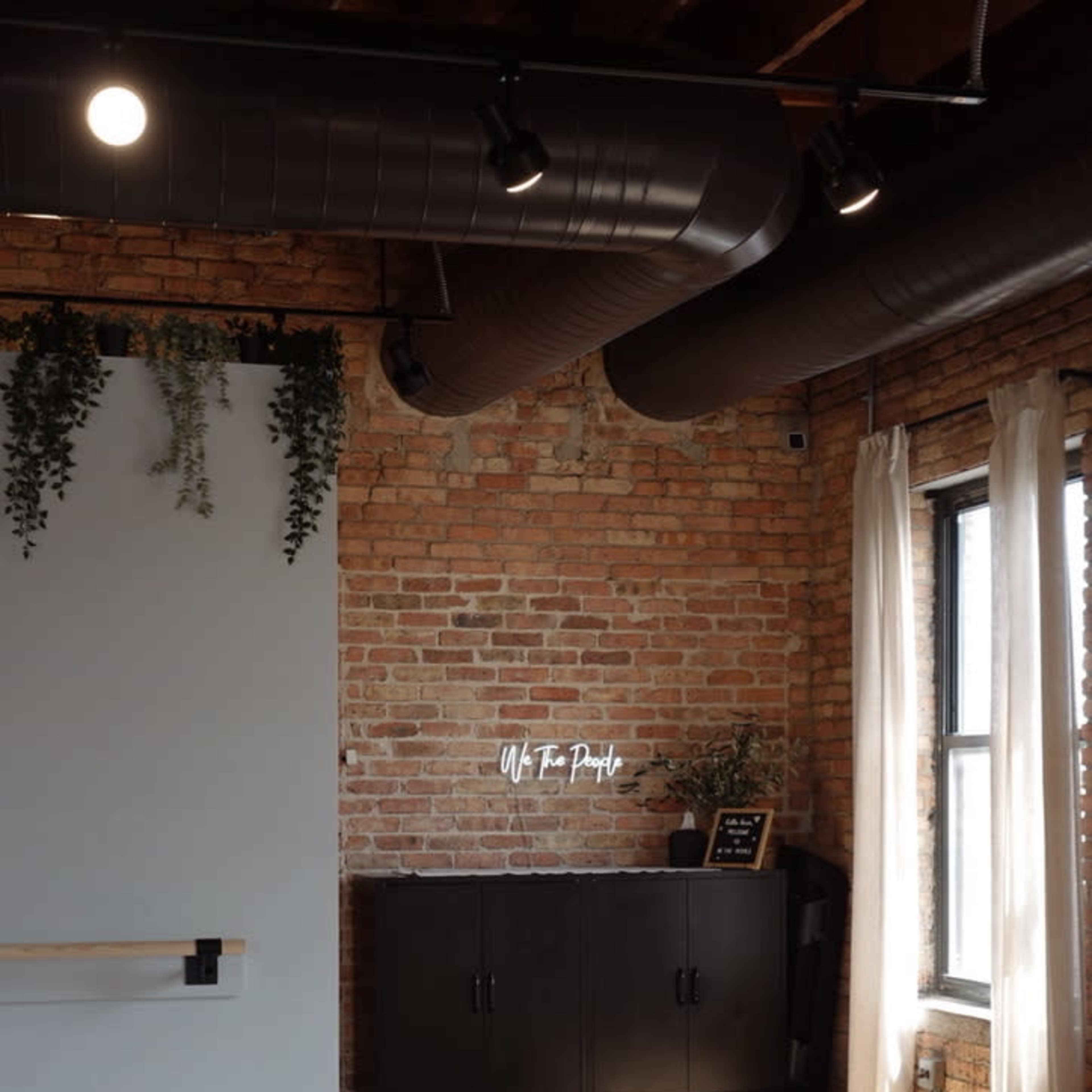 Beautiful timber loft fitness studio with equipment, skyline view and outdoor space. Image in Chicago, Chicago, IL