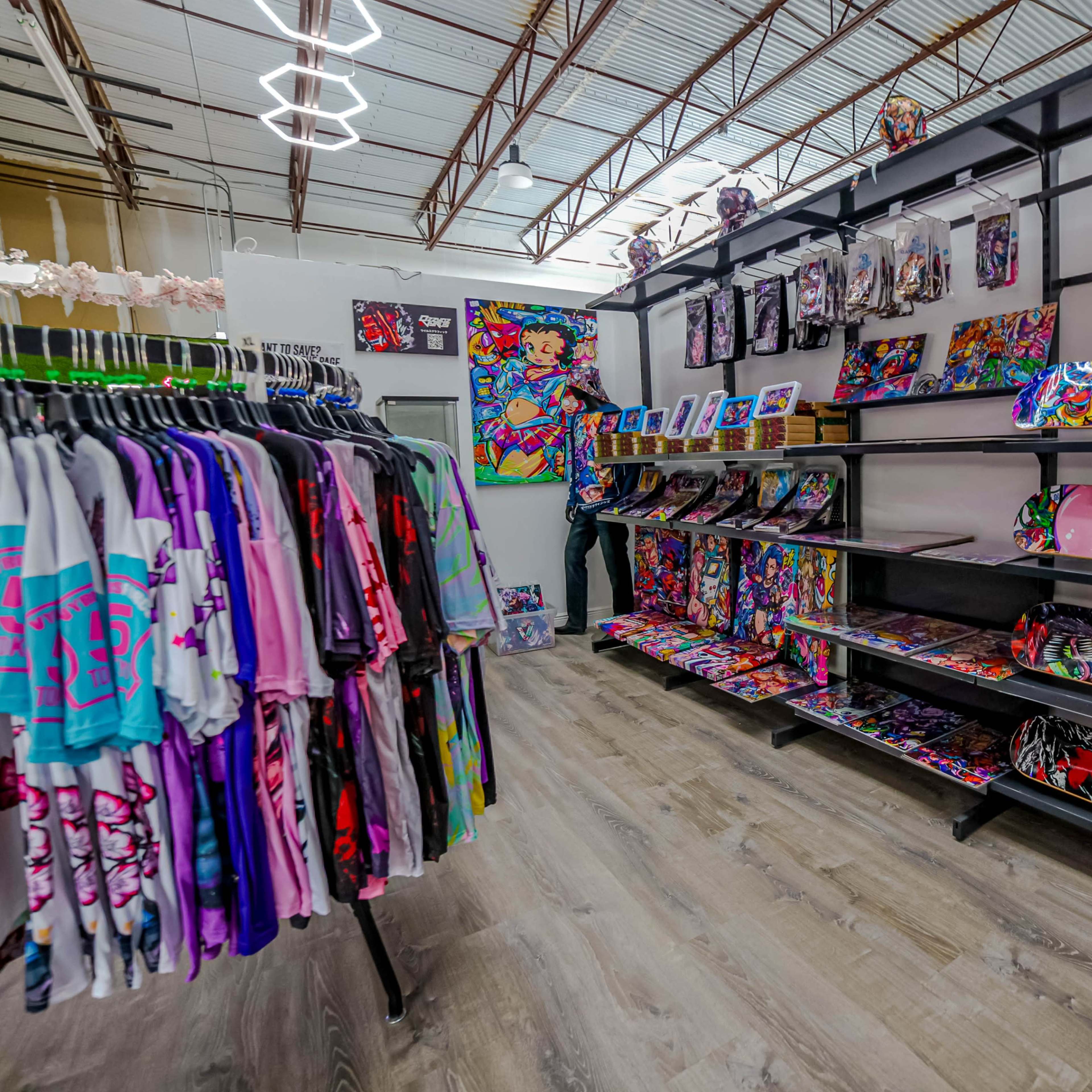 A vibrant retail store features racks of colorful apparel and shelves displaying artistic skateboard decks against a modern backdrop.