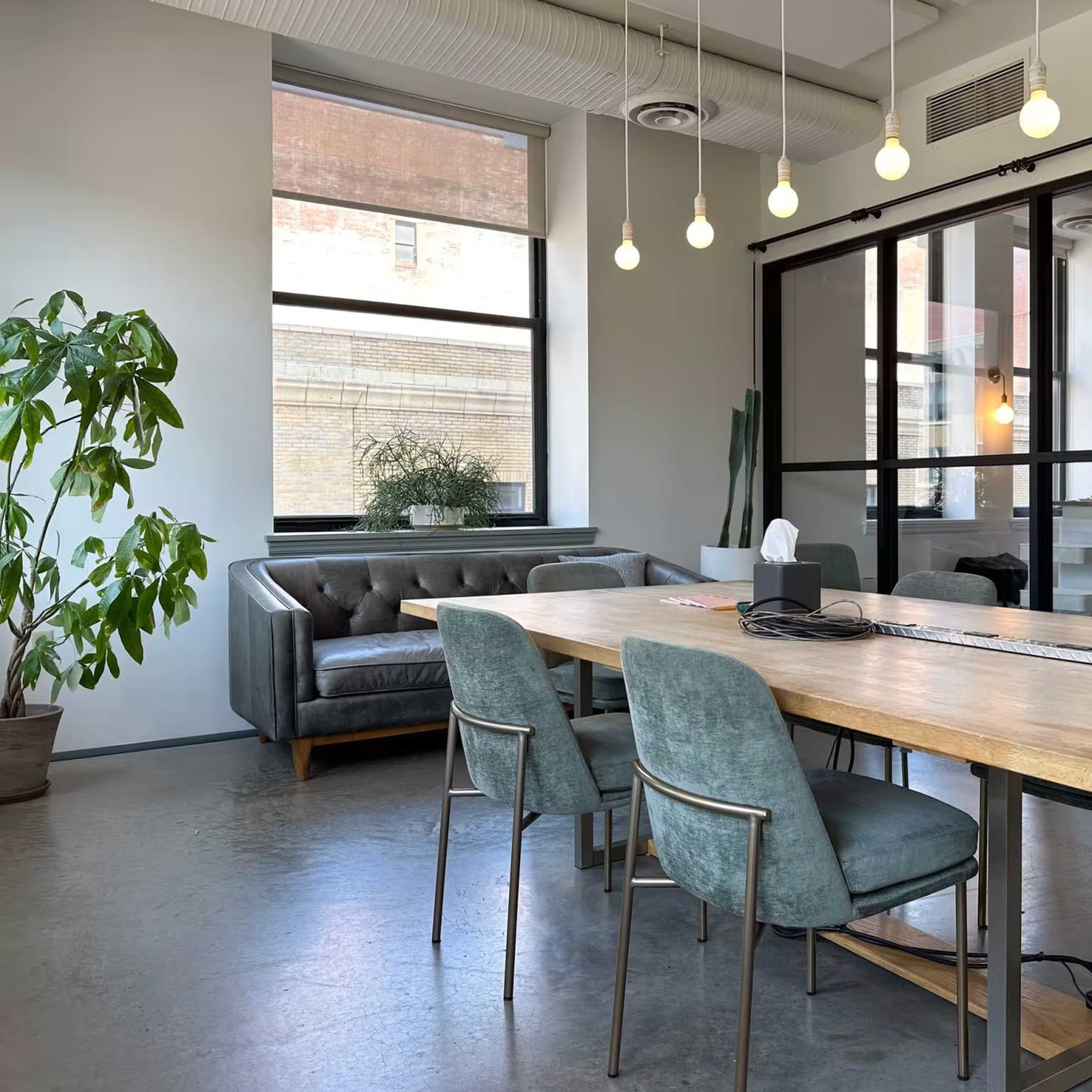 Bright, Beautiful Meeting Room with Huge Windows, Glassboard, and TV for Screen Mirroring Image in East Liberty, Pittsburgh, PA