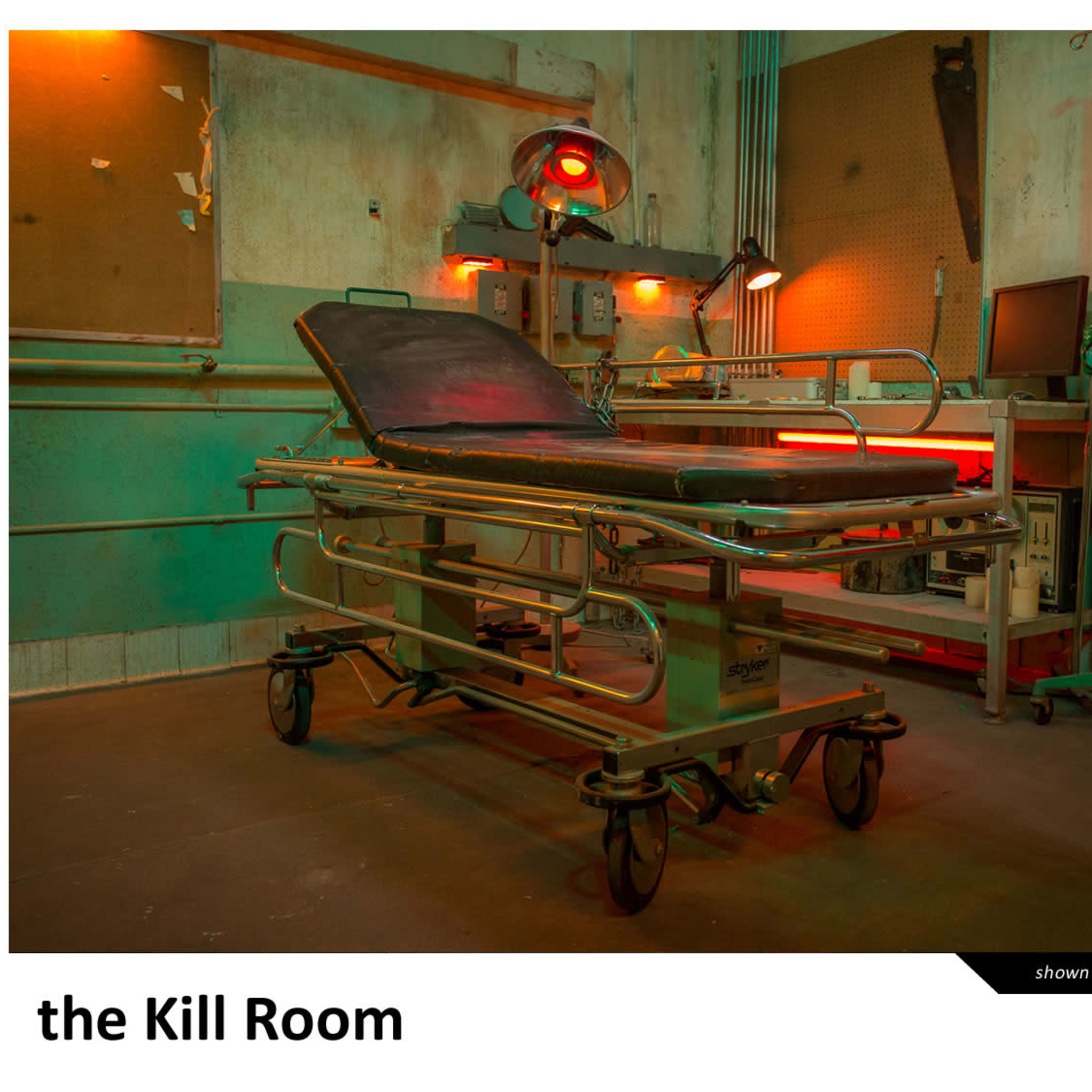 A dimly lit room featuring a stainless steel examination table surrounded by various medical equipment and eerie lighting.