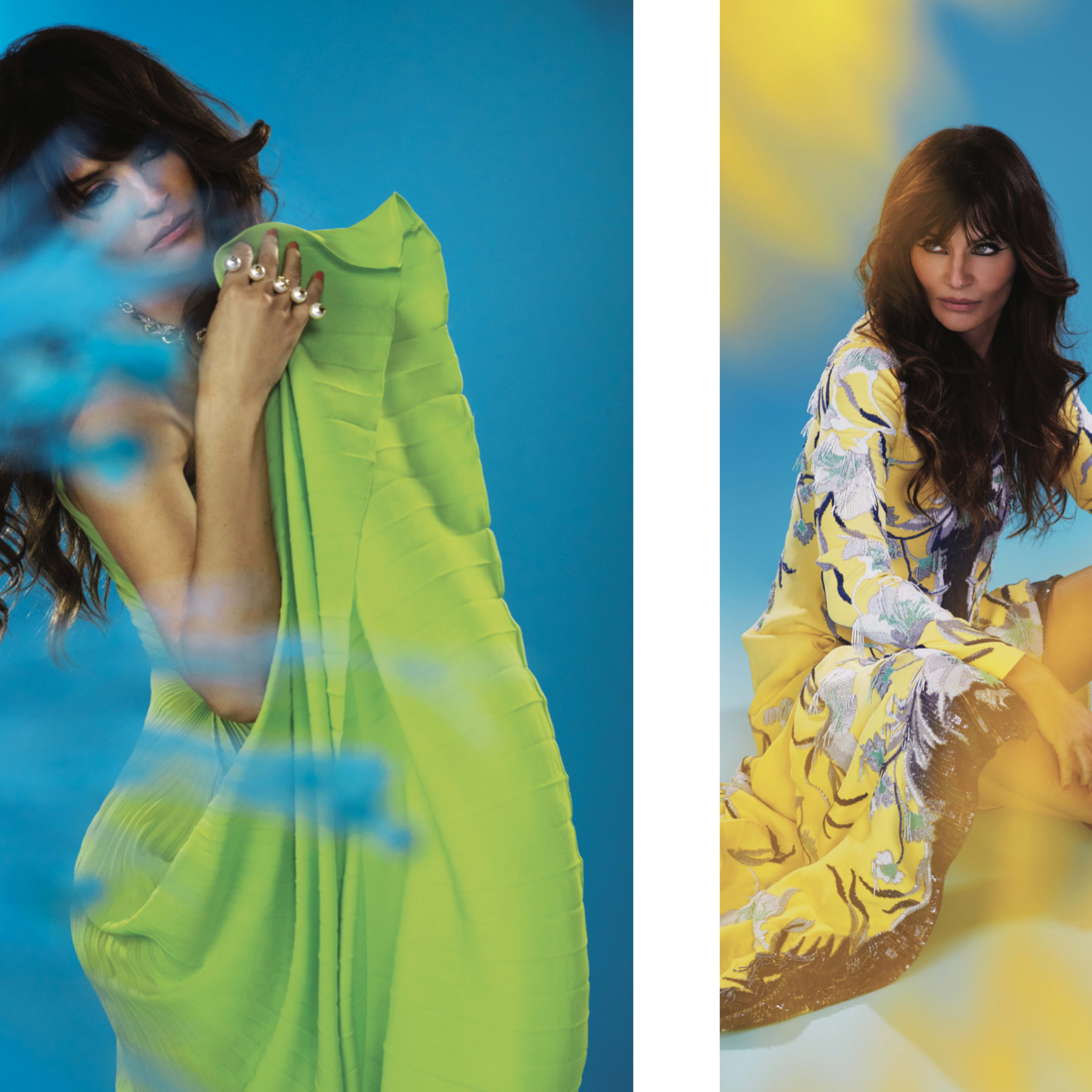 A model posing in two stylized outfits against a blue backdrop, one wearing a green draped garment and the other in a floral-printed dress with black boots.
