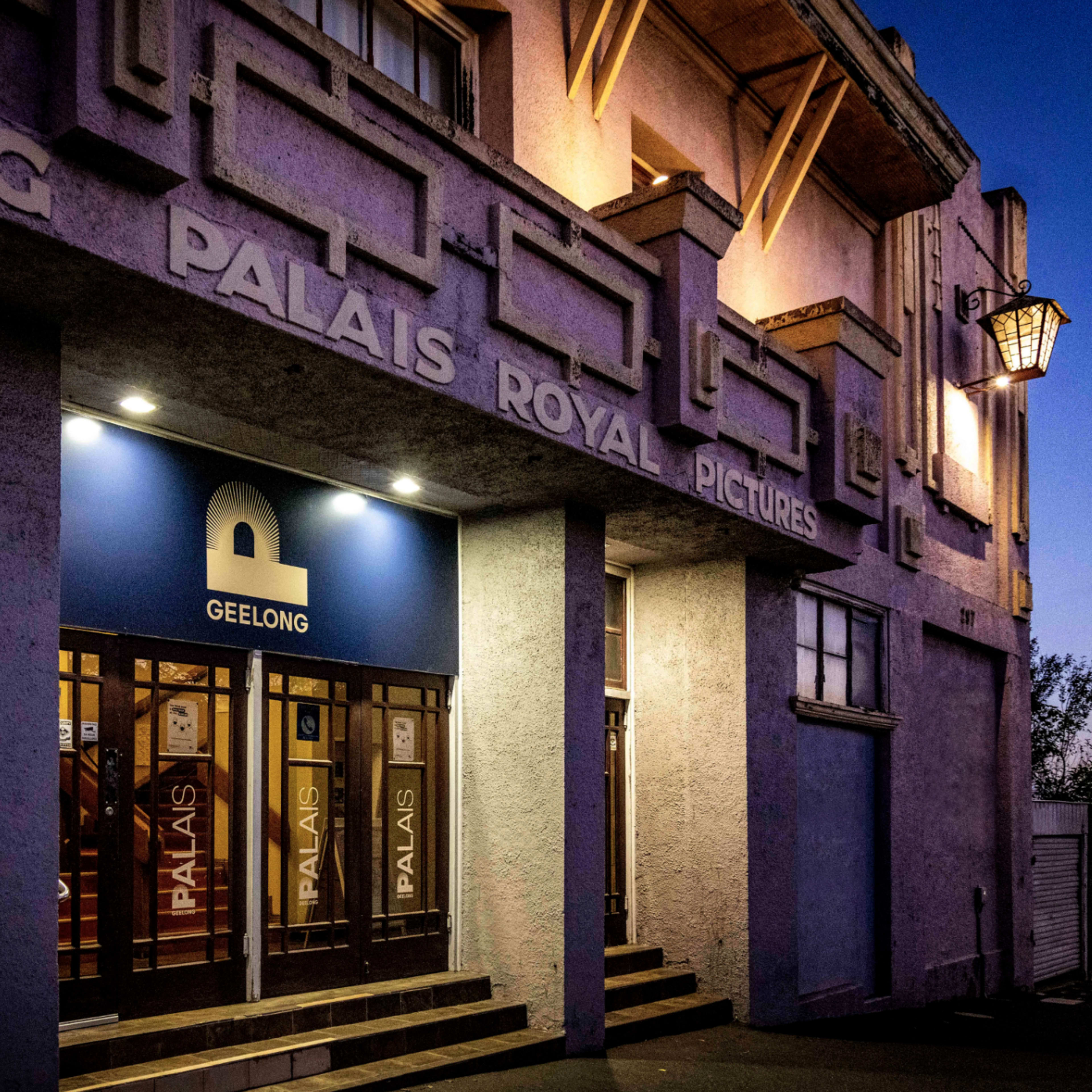 The entrance of the Palais Royal Pictures building in Geelong, featuring a large blue sign with the letter "P."