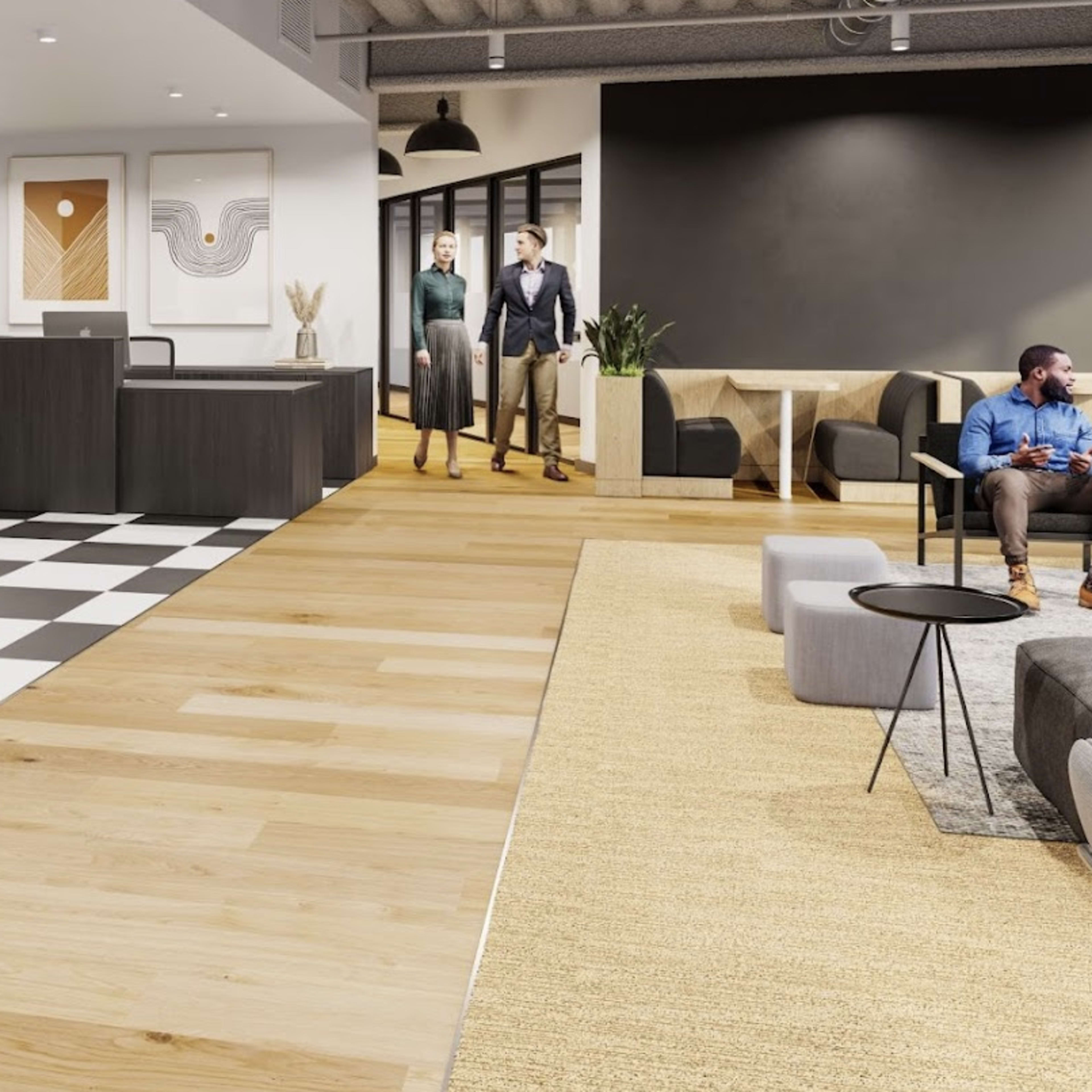 A modern office reception area with a checkered black and white floor, wooden flooring, and a seating area, where several people are engaged in conversation.