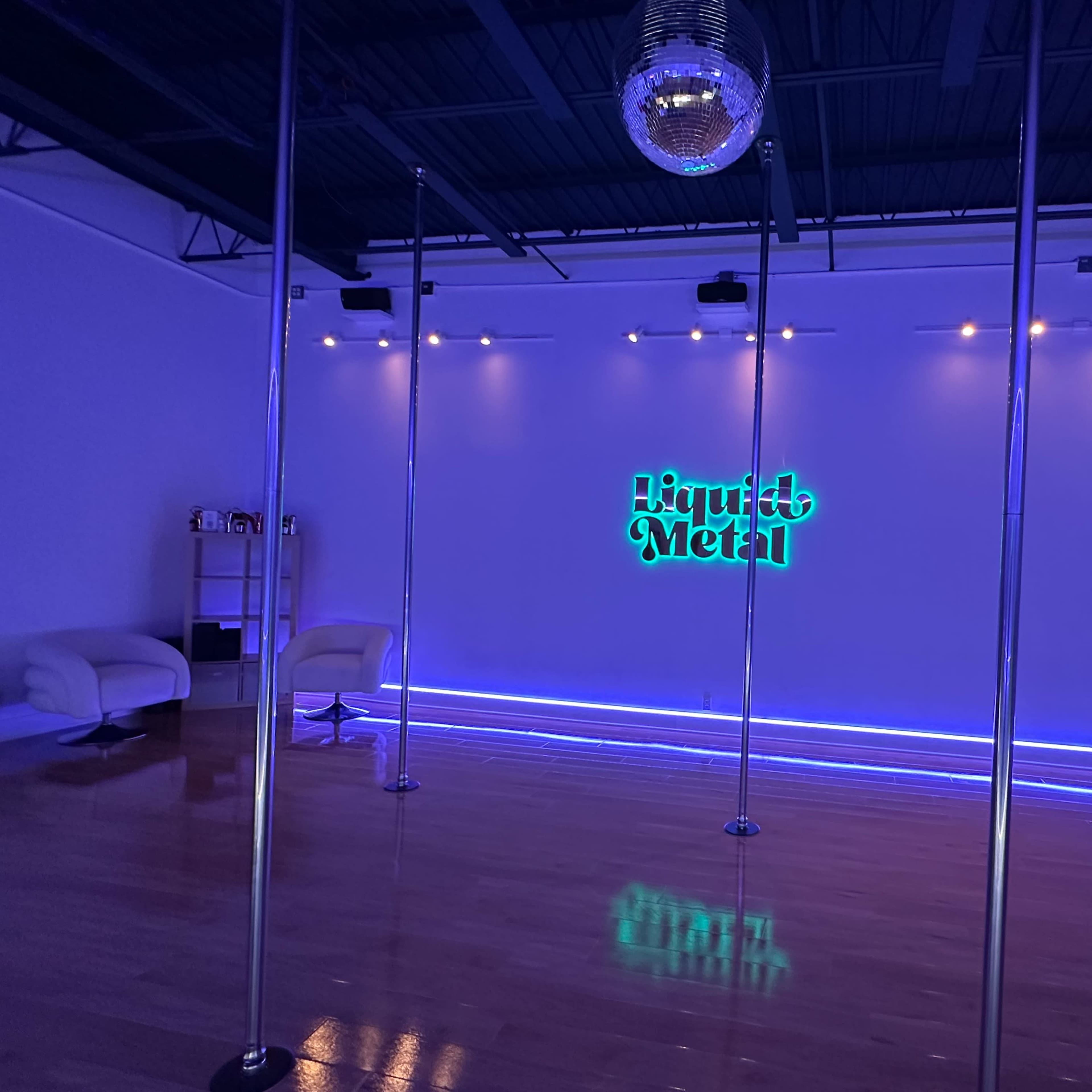Loft studio space with two studios, 1150 sq ft, 13 foot ceilings, studio quality lighting and custom LEDs. Used as a dance and pole dance studio during the day. Equipment including poles are easily removed for special events and photography usage. Image in Pinellas Park, Pinellas Park, FL