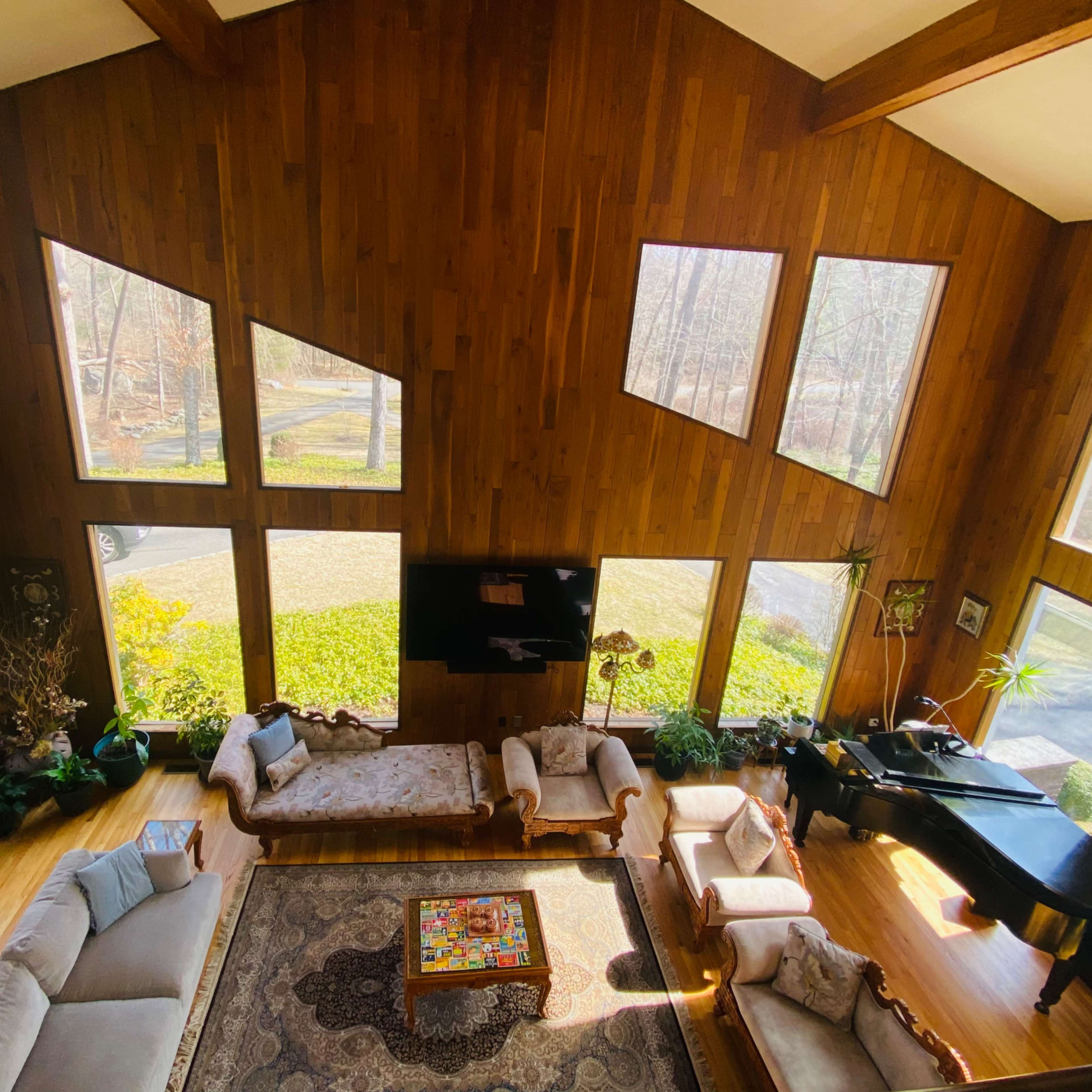 Rich Cedar Paneled Living Room with Expansive Floor to Ceiling Windows Image in Brookfield, Brookfield, CT