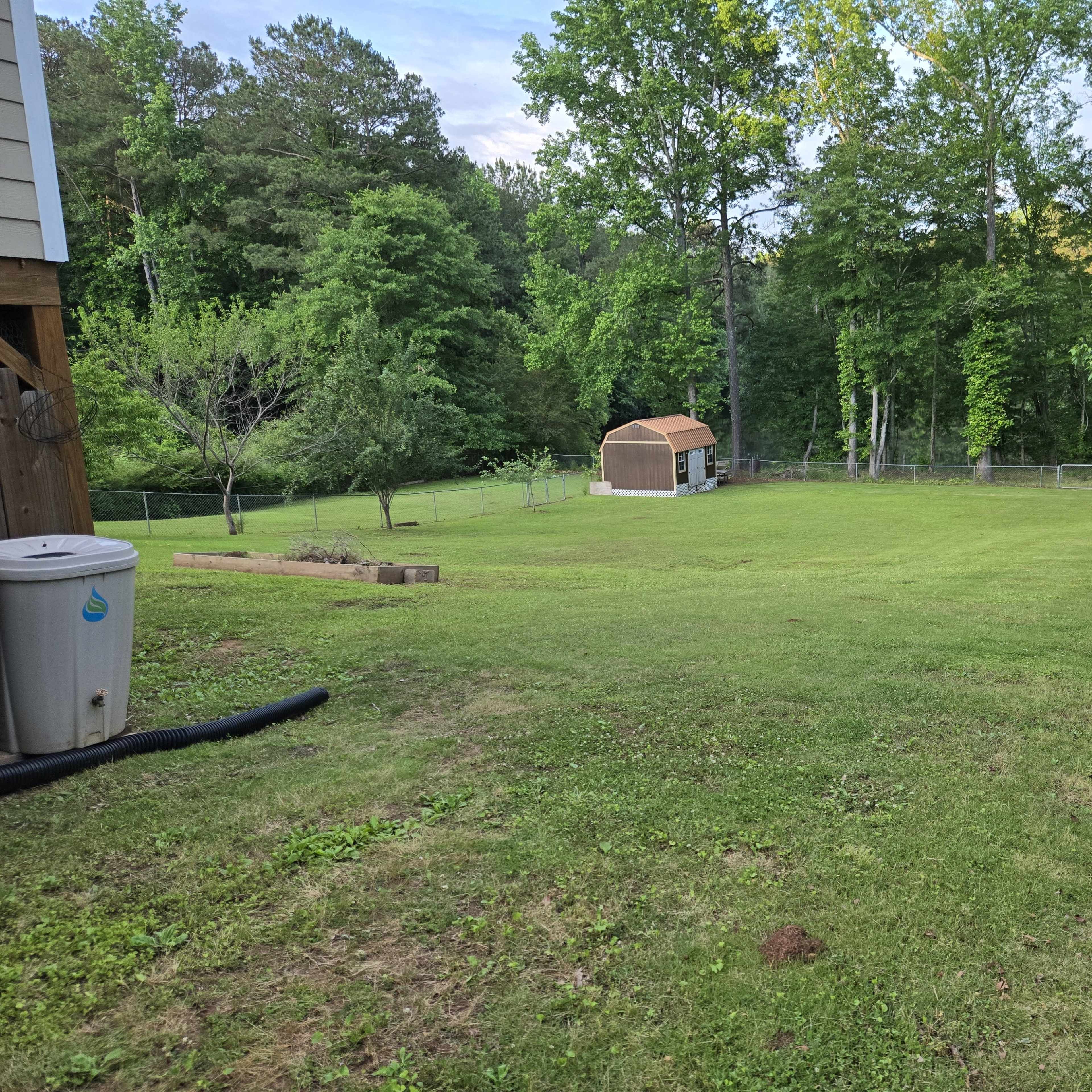 Large backyard with pond view Image in , Stockbridge, GA