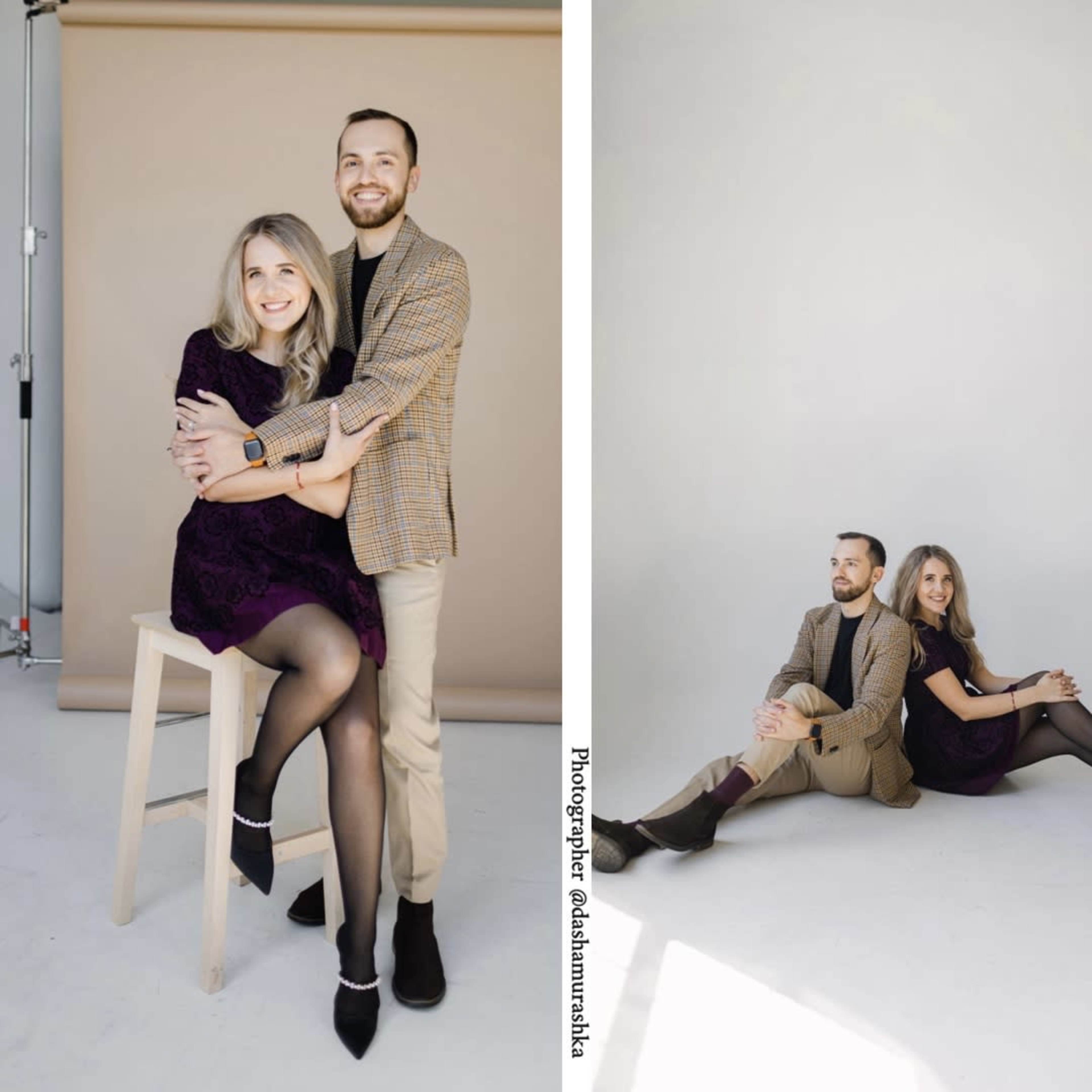 A couple poses together in a photography studio with neutral backgrounds, showcasing different seated and standing arrangements.