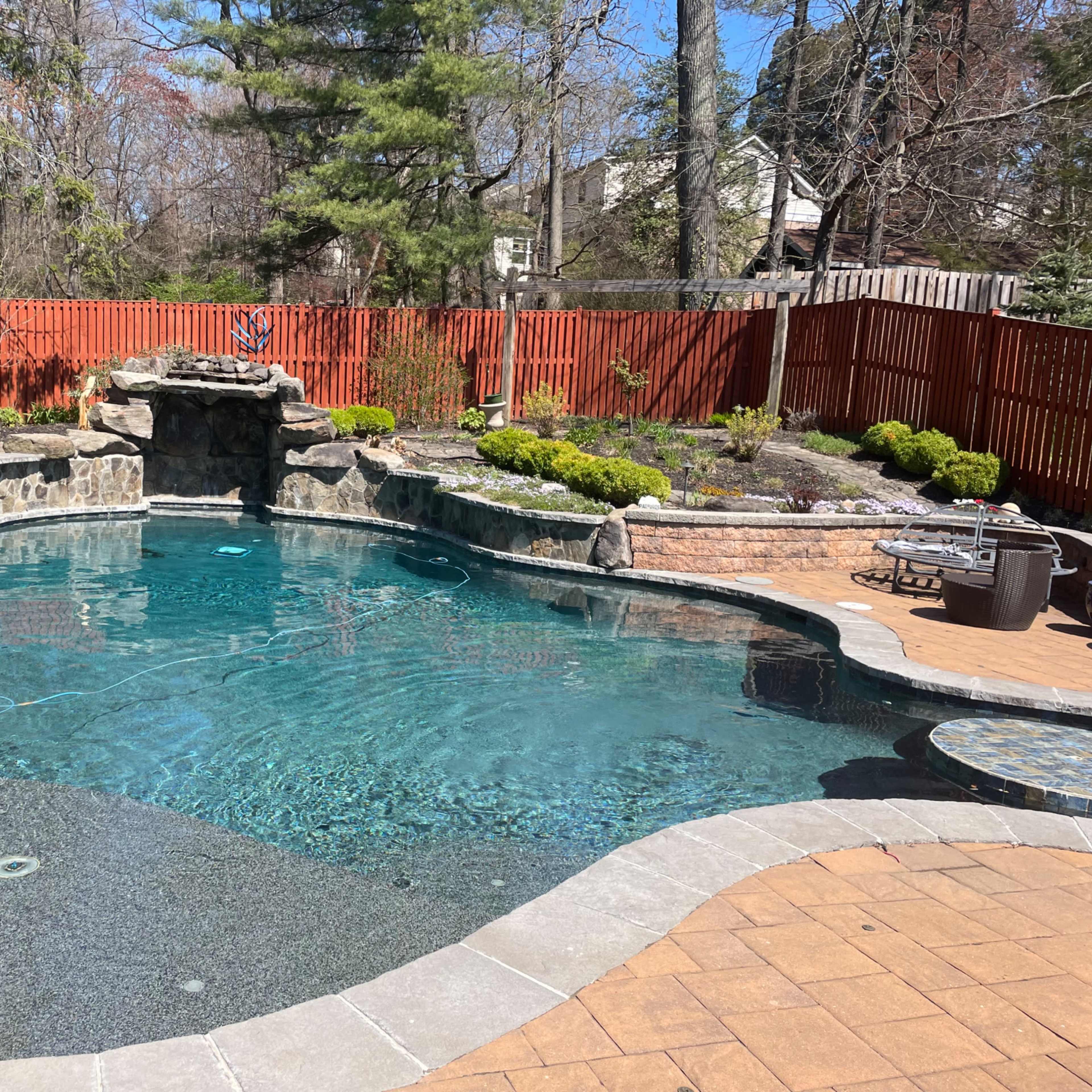 Pool with grotto surrounded by  tropical gardens Image in Savage, Savage, MD