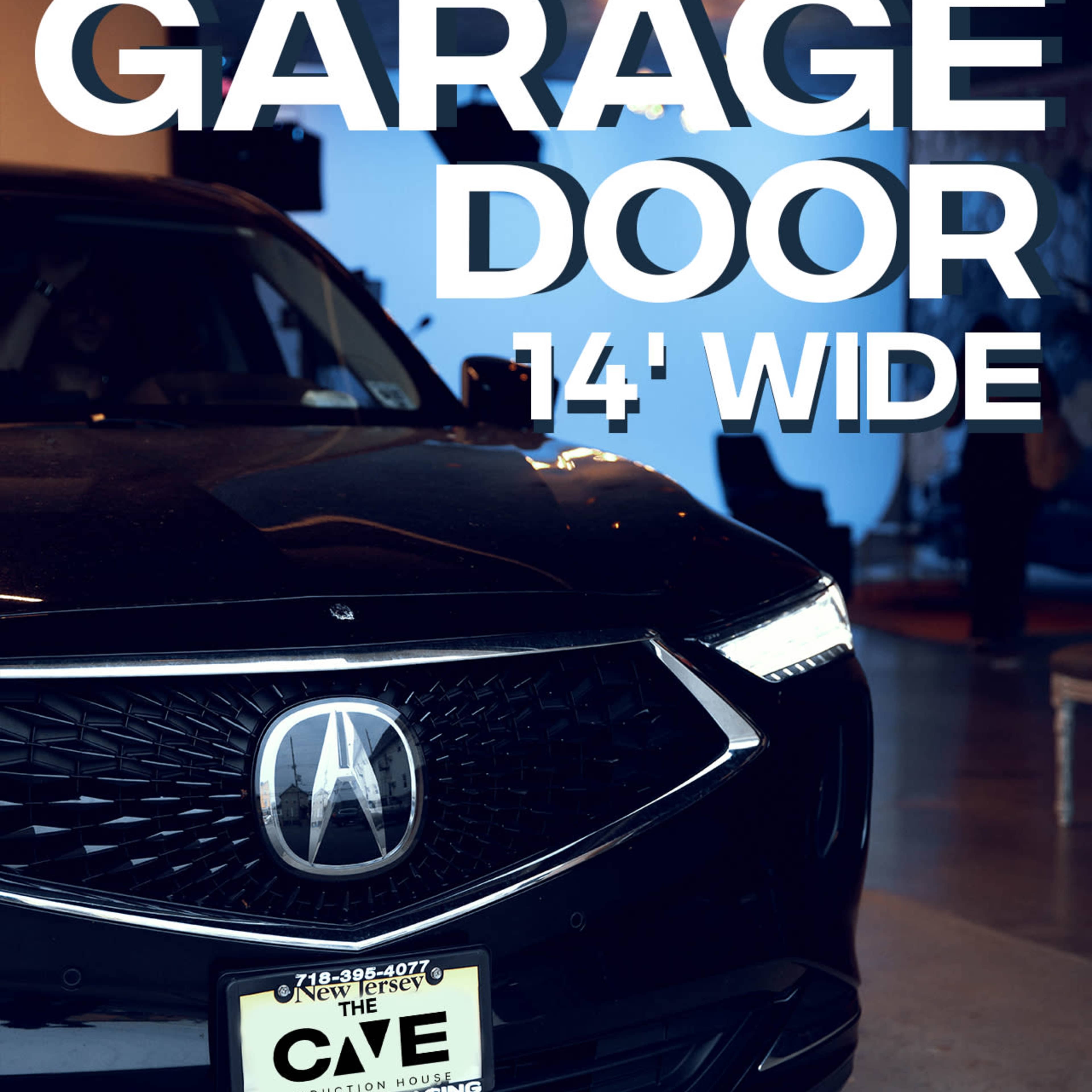 A black Acura is parked in a garage with a 14-foot wide garage door visible.