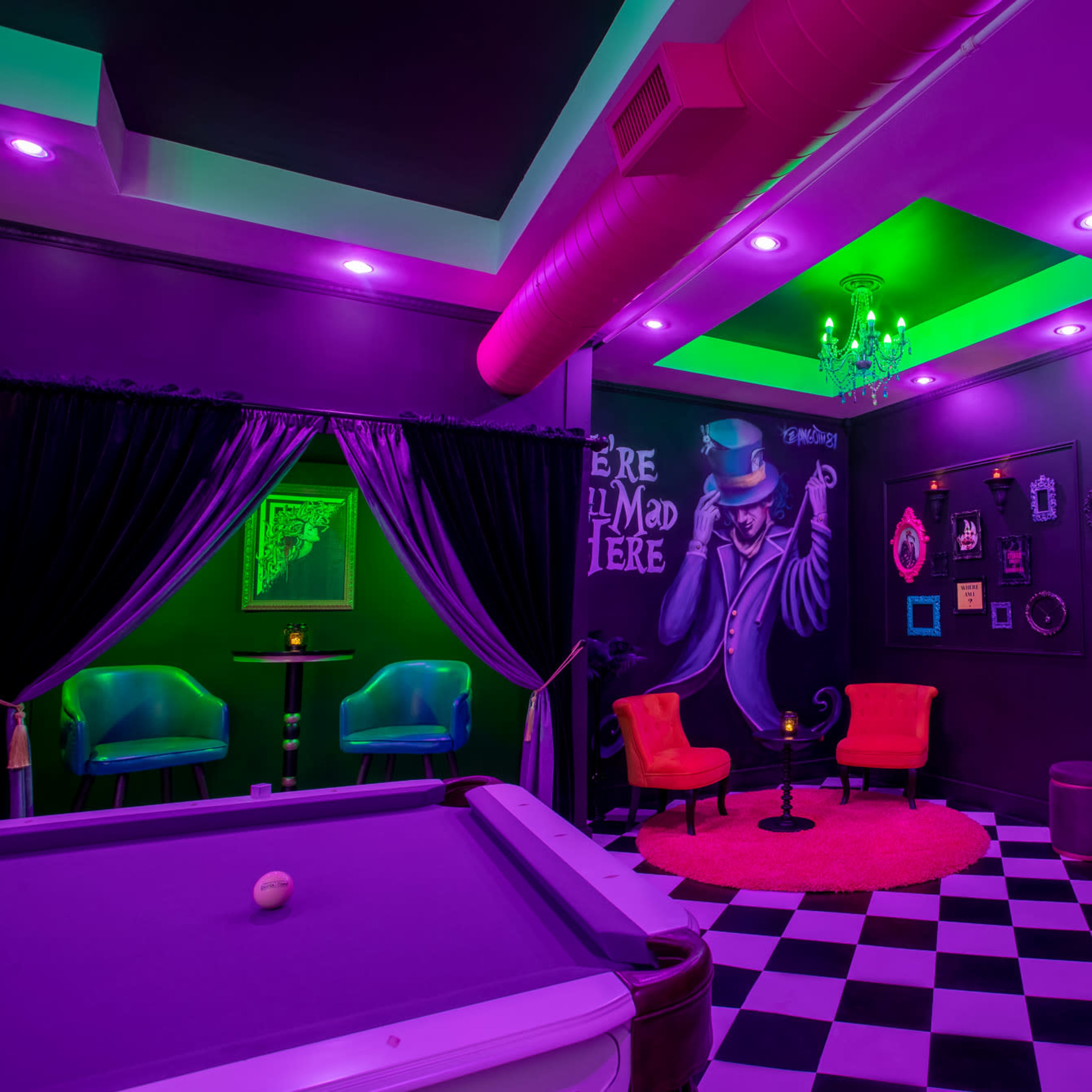 The scene features a vibrant lounge with purple and green lighting, a billiards table, and eclectic seating arranged around a central area.