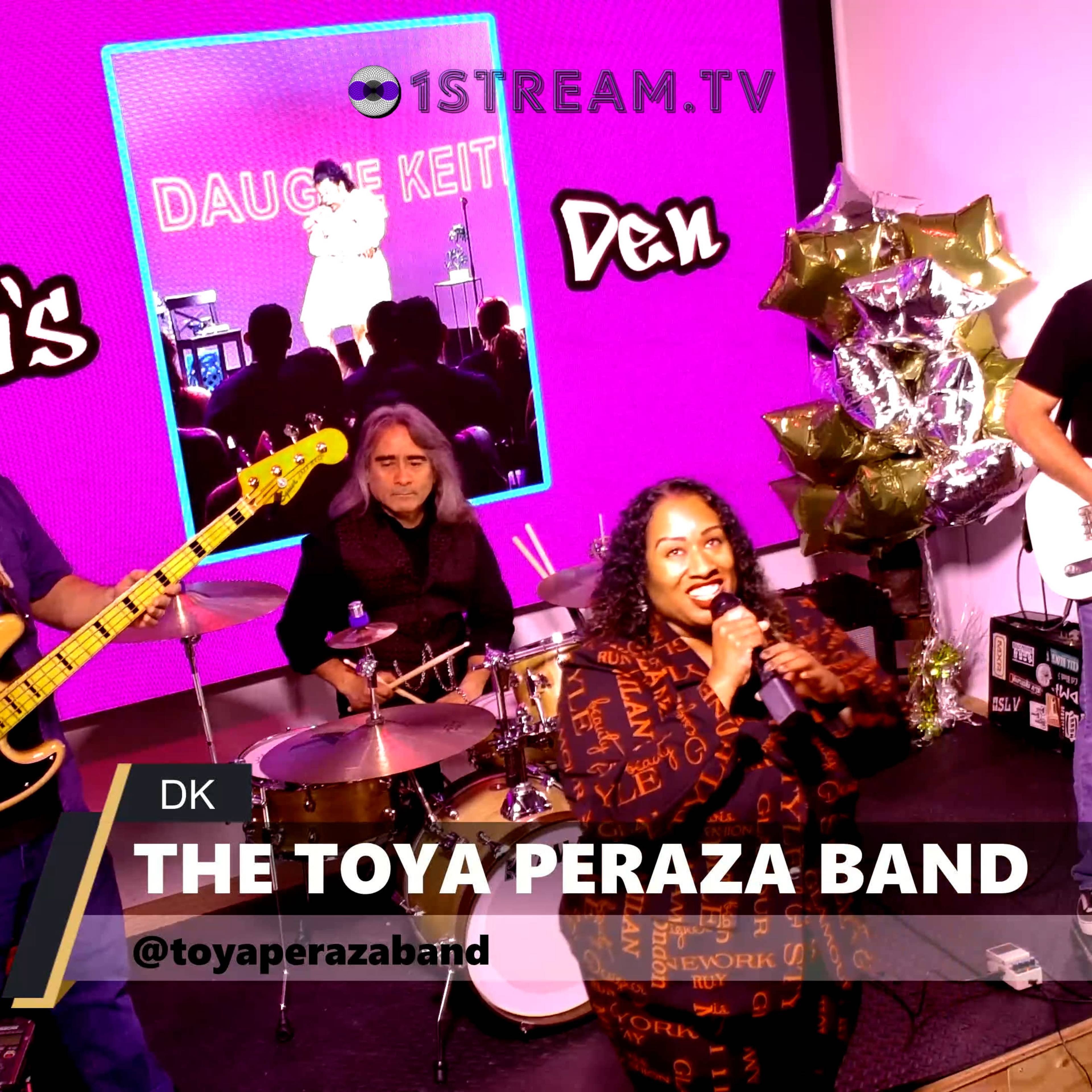 The Toya Peraza Band performs on stage with a guitarist, bassist, drummer, and vocalist in front of a vibrant purple backdrop.