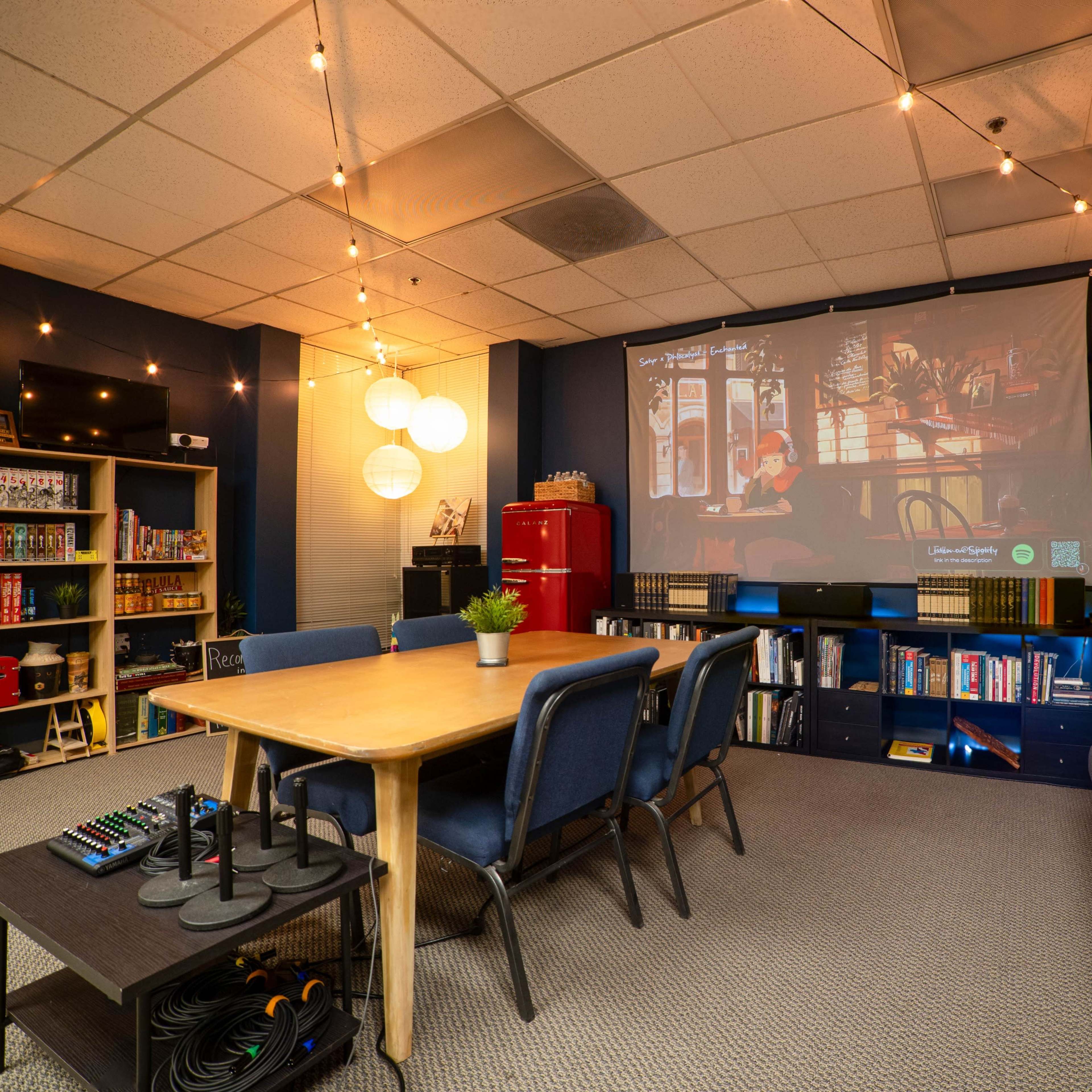 Cozy, Warm Meeting Space with Projector and Writing Materials Image in Northside, Riverside, CA
