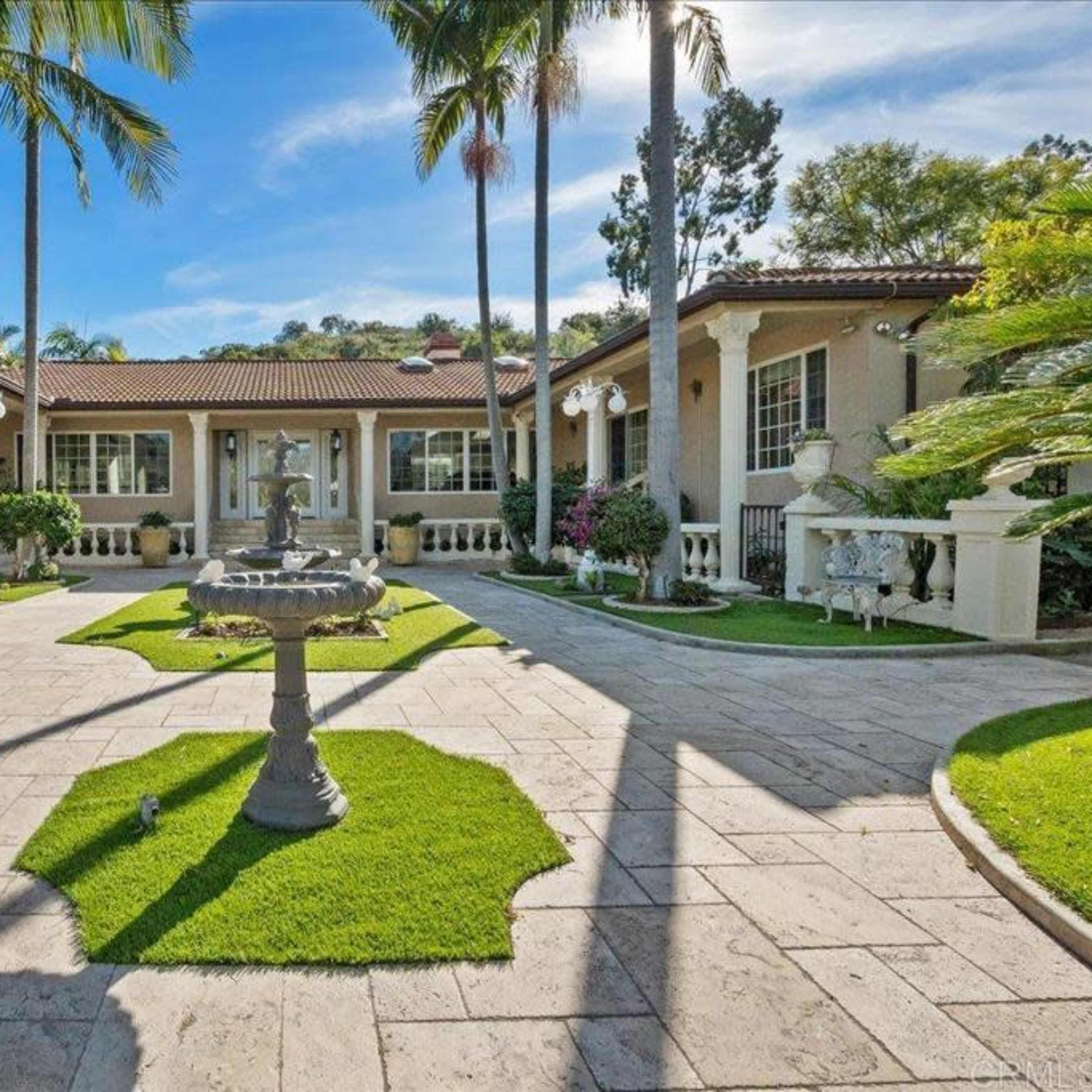 Elegant Outdoor Oasis with Lush Gardens, Pool, and Patios—Perfect for Daytime Events in Vista Image in , Vista, CA
