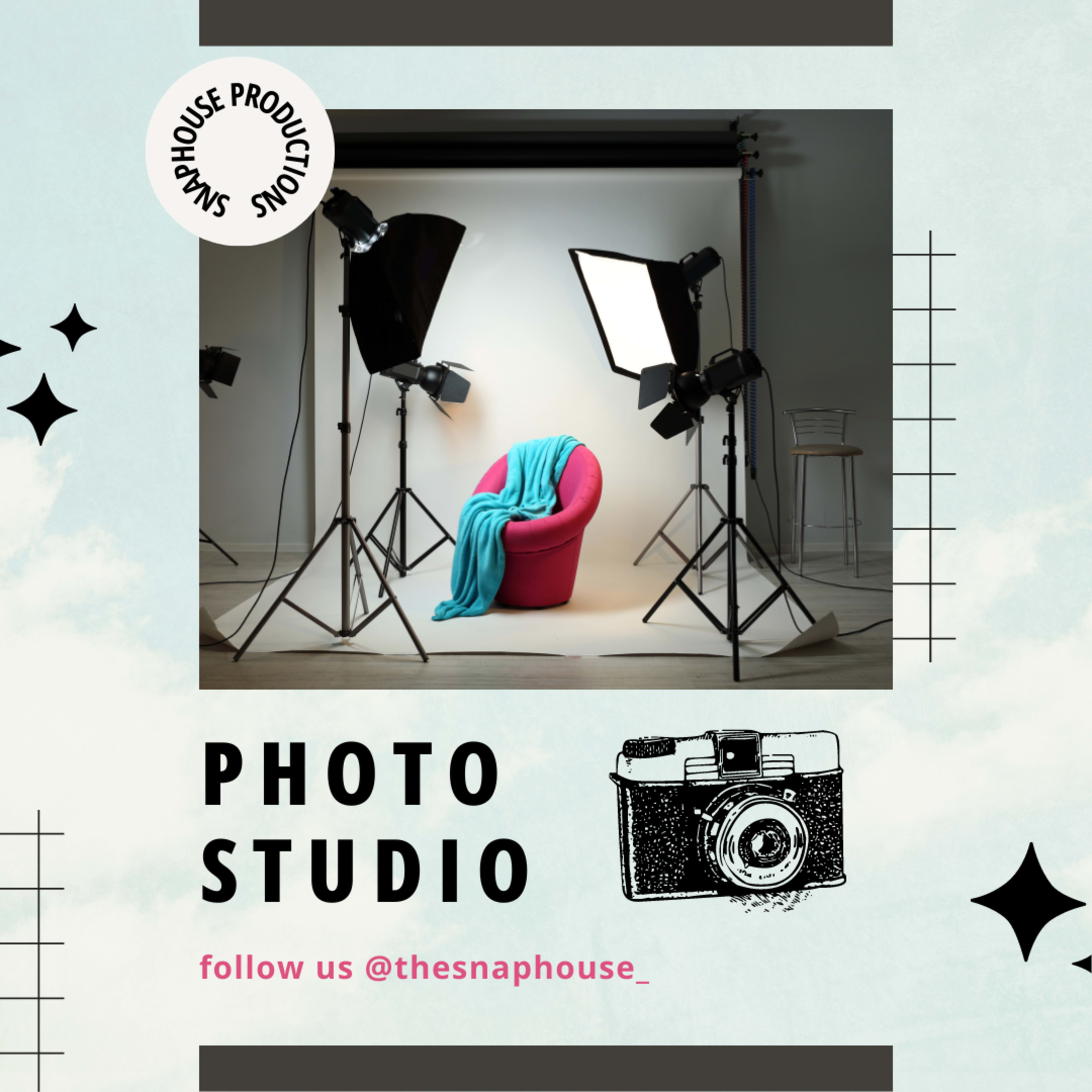 A photo studio setup with a pink chair, a turquoise blanket draped over it, and multiple lighting equipment positioned around the chair.