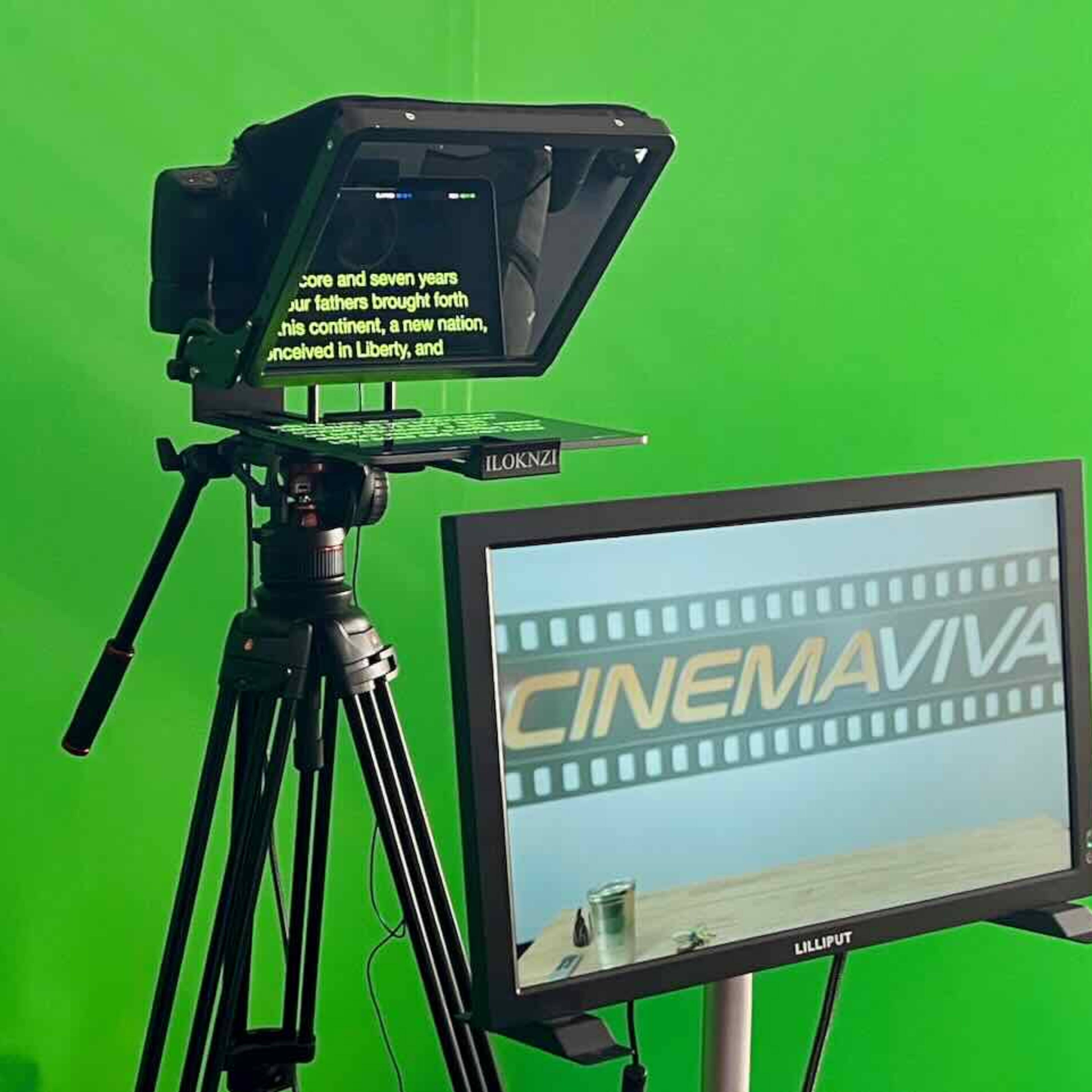 A teleprompter is set up on a tripod in front of a green screen, with a monitor displaying the text "CINEMAVIVA."