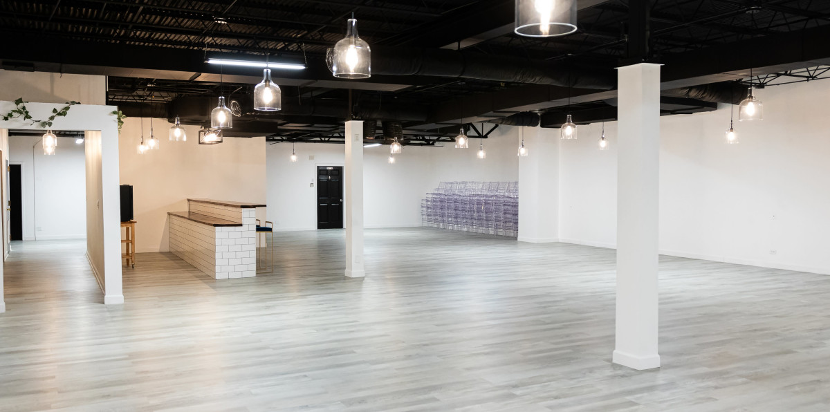 Chic Elegance: A Stylish Venue with Black Ceilings, Grey Floors, and Stunning Pendant Lights in Portage Park,chicagoIL | Peerspace