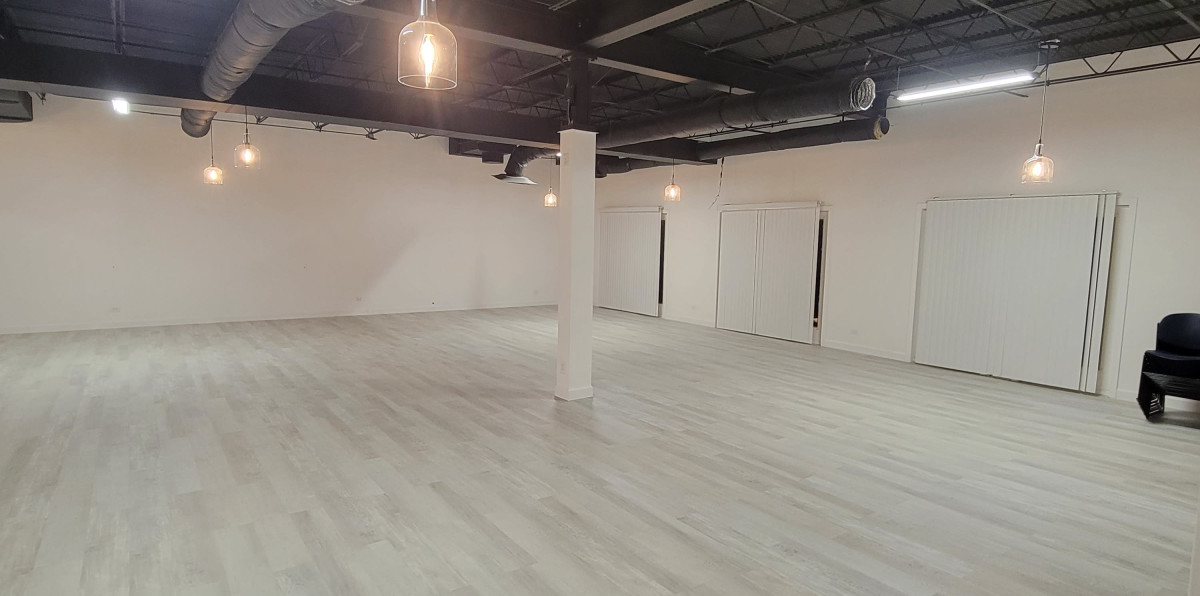 Chic Elegance: A Stylish Venue with Black Ceilings, Grey Floors, and Stunning Pendant Lights in Portage Park,chicagoIL | Peerspace