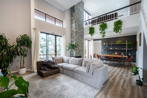 Penthouse Loft Covered In Plants With Natural Light Multiple Balconies Photo Inspiration