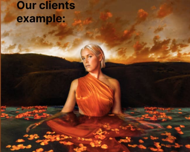 A woman in a flowing orange dress sits in water surrounded by floating petals, with a dramatic sunset in the background.