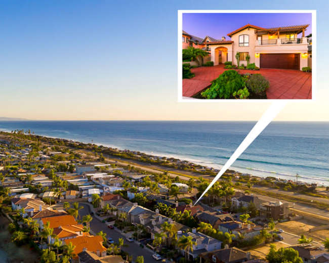 A coastal residential area with beachside homes and a view of the ocean, highlighting one property in an inset.